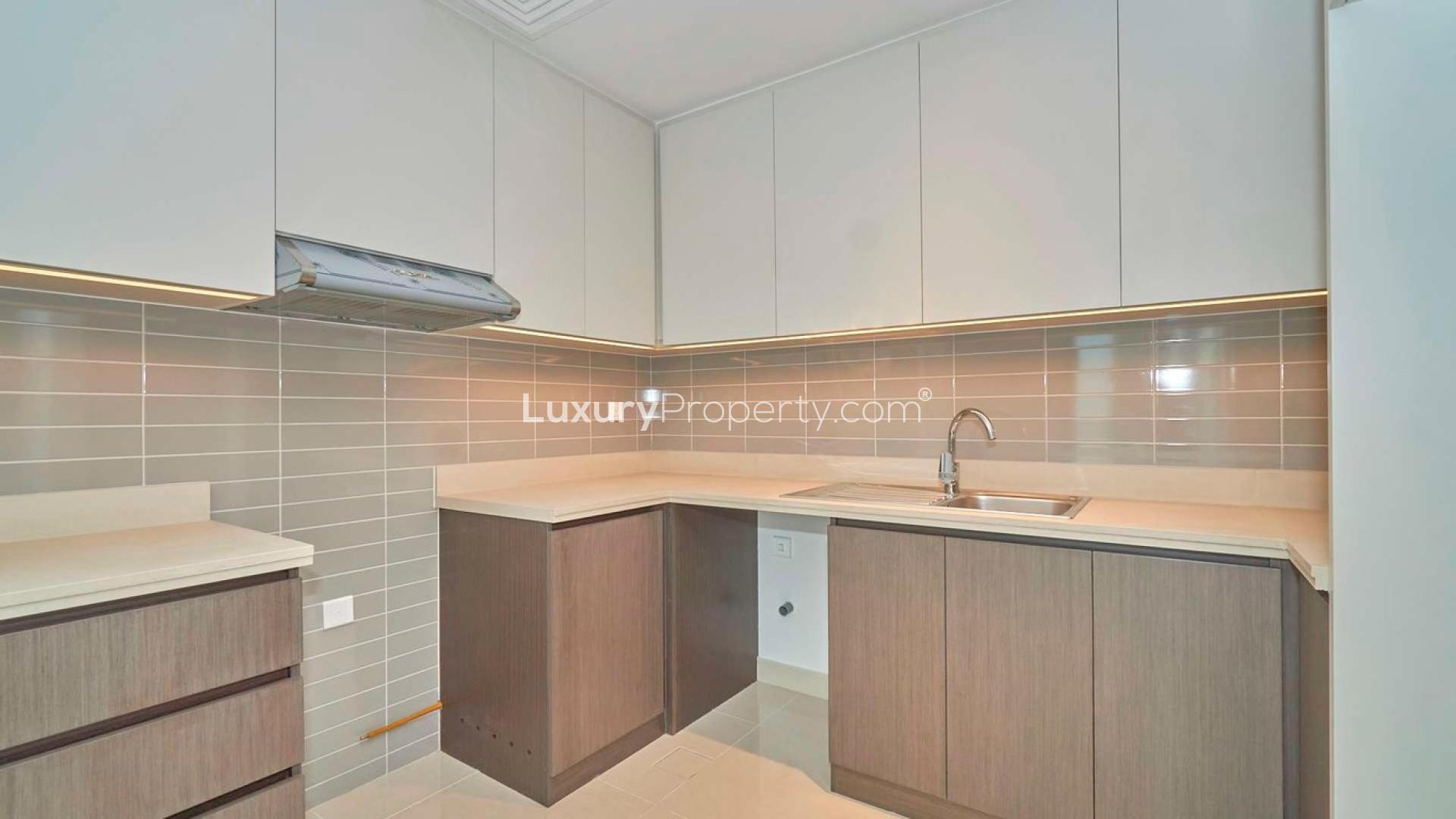 Spacious Dubai Creek Harbour apartment interior with balcony and park views, for sale