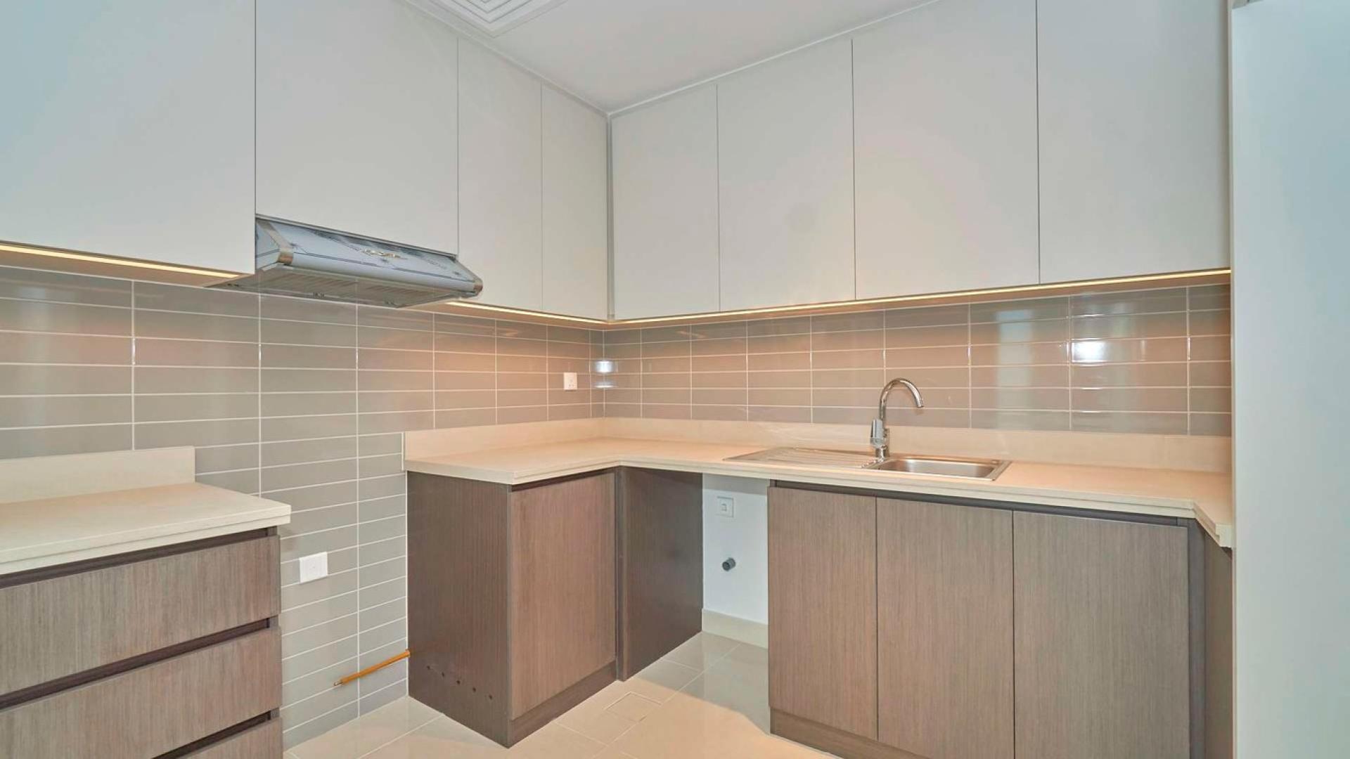 Spacious Dubai Creek Harbour apartment interior with balcony and park views, for sale