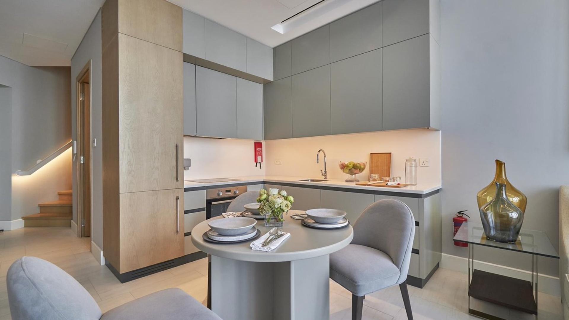 Modern open-plan living area in luxury loft, Business Bay, Dubai, with city views