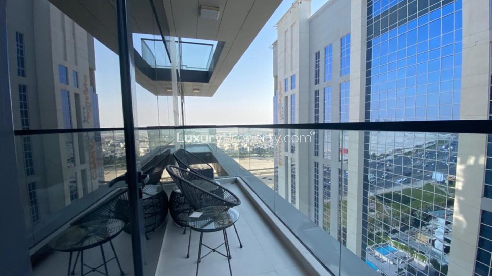 Balcony view from Vezul Residence apartment in Business Bay with modern outdoor seating