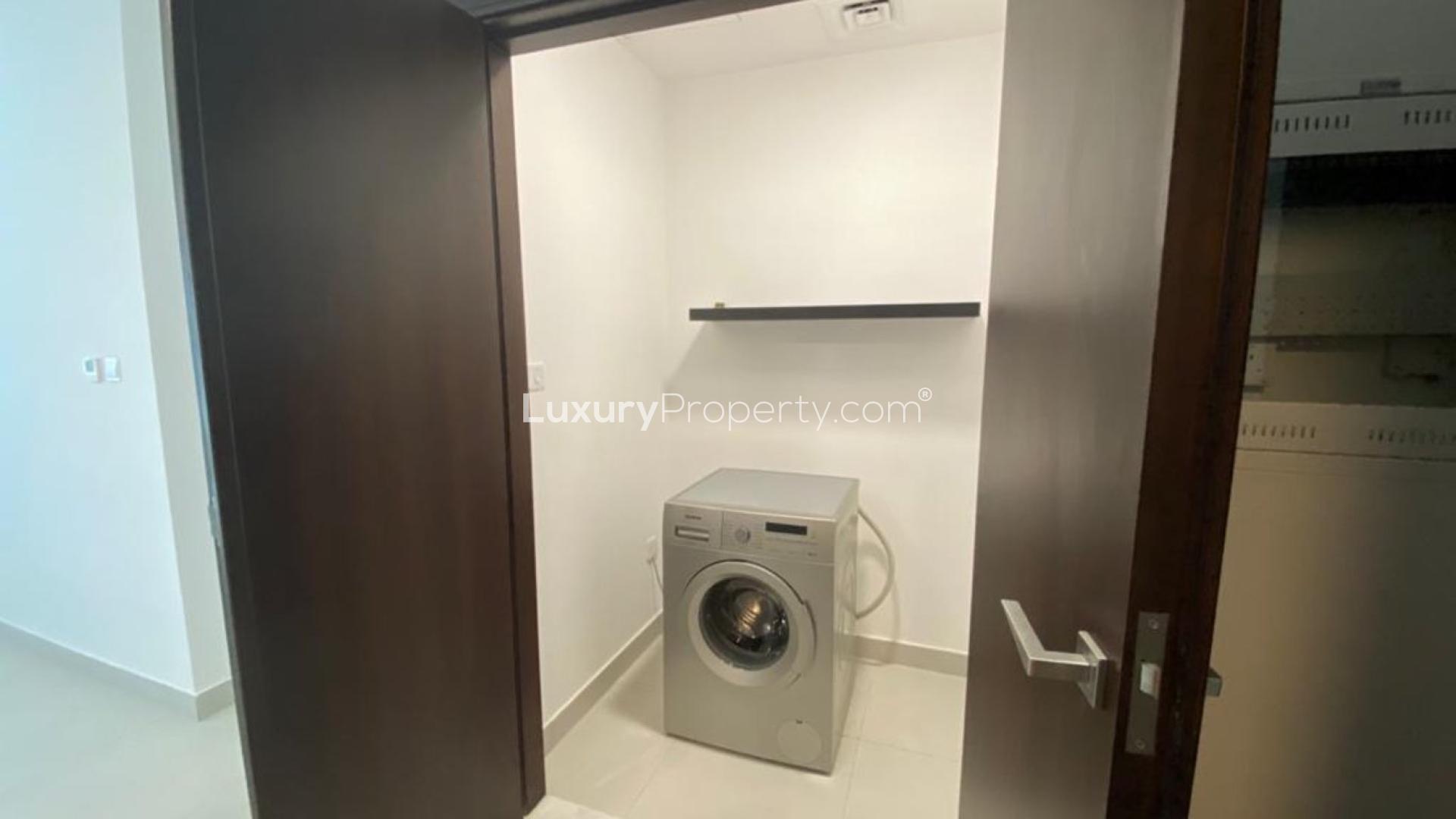 Modern living room in Vezul Residence apartment, Business Bay, with elegant decor and balcony view