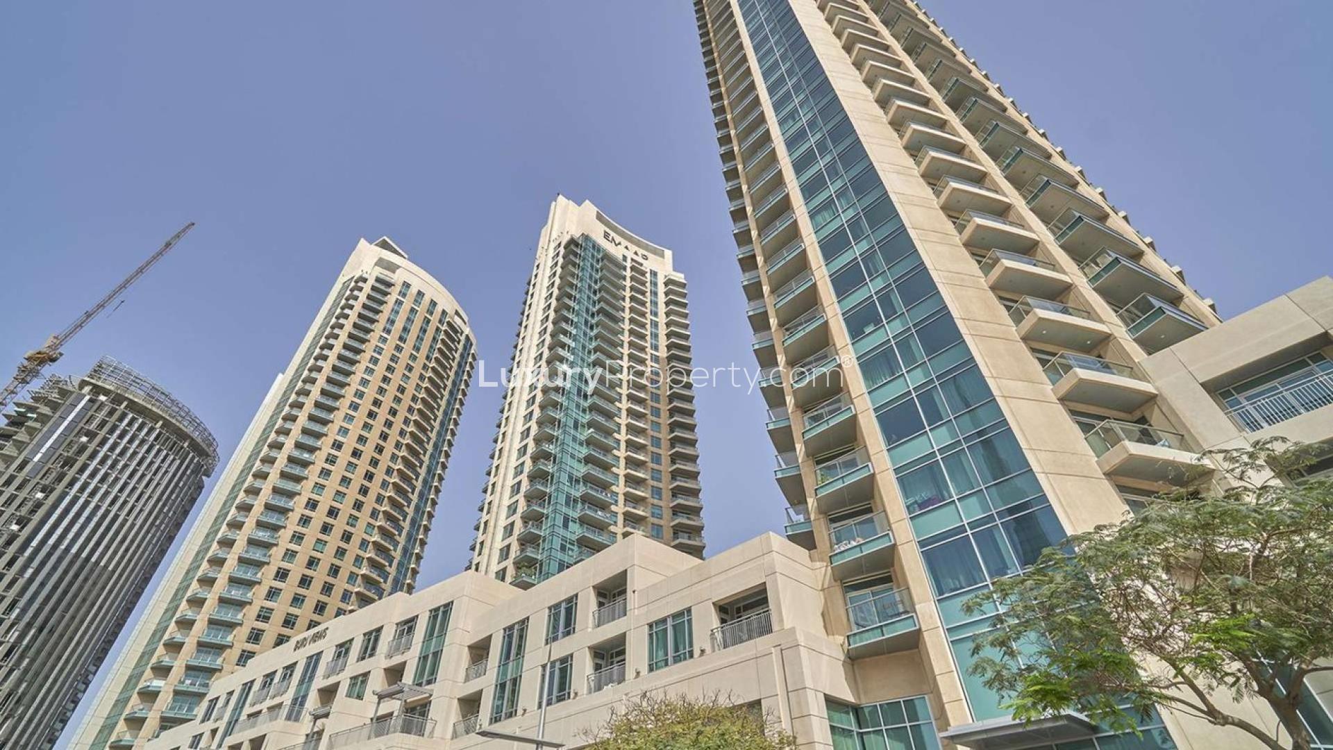 "Modern high-rise apartment building in Burj Views, Downtown Dubai, for sale. LP07304 listing.",Skyscraper view of Burj Views apartment for sale in Downtown Dubai, one bedroom