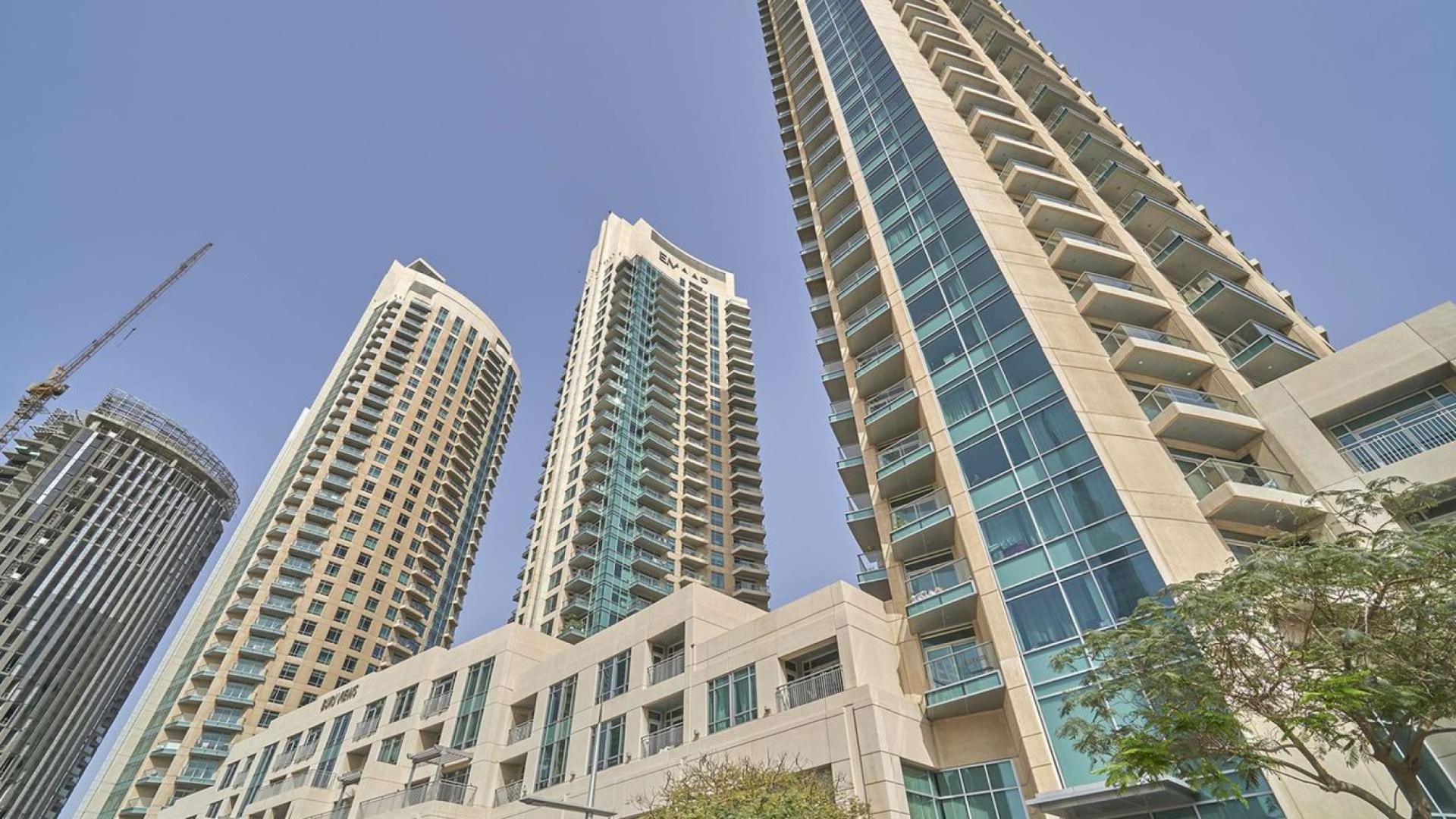 "Modern high-rise apartment building in Burj Views, Downtown Dubai, for sale. LP07304 listing.",Skyscraper view of Burj Views apartment for sale in Downtown Dubai, one bedroom