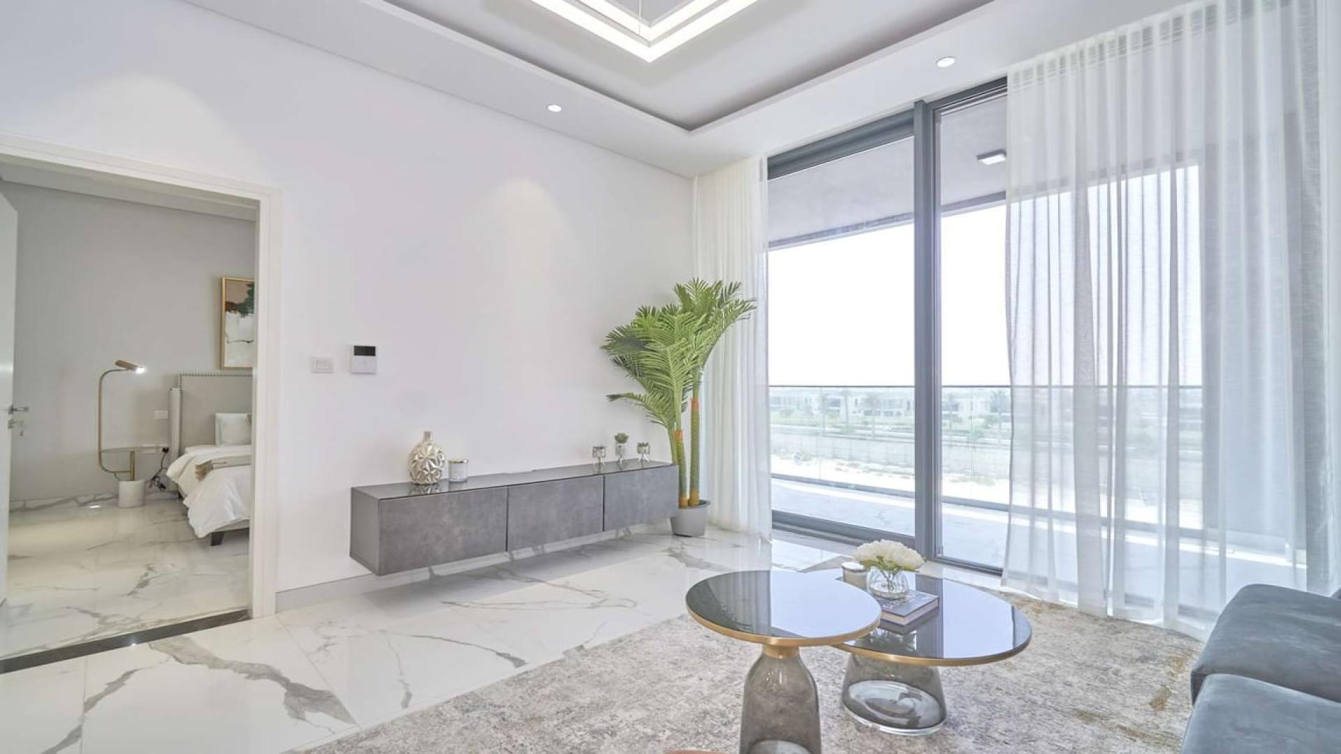 Gorgeous Dubai Hills apartment living room with modern decor and large window views