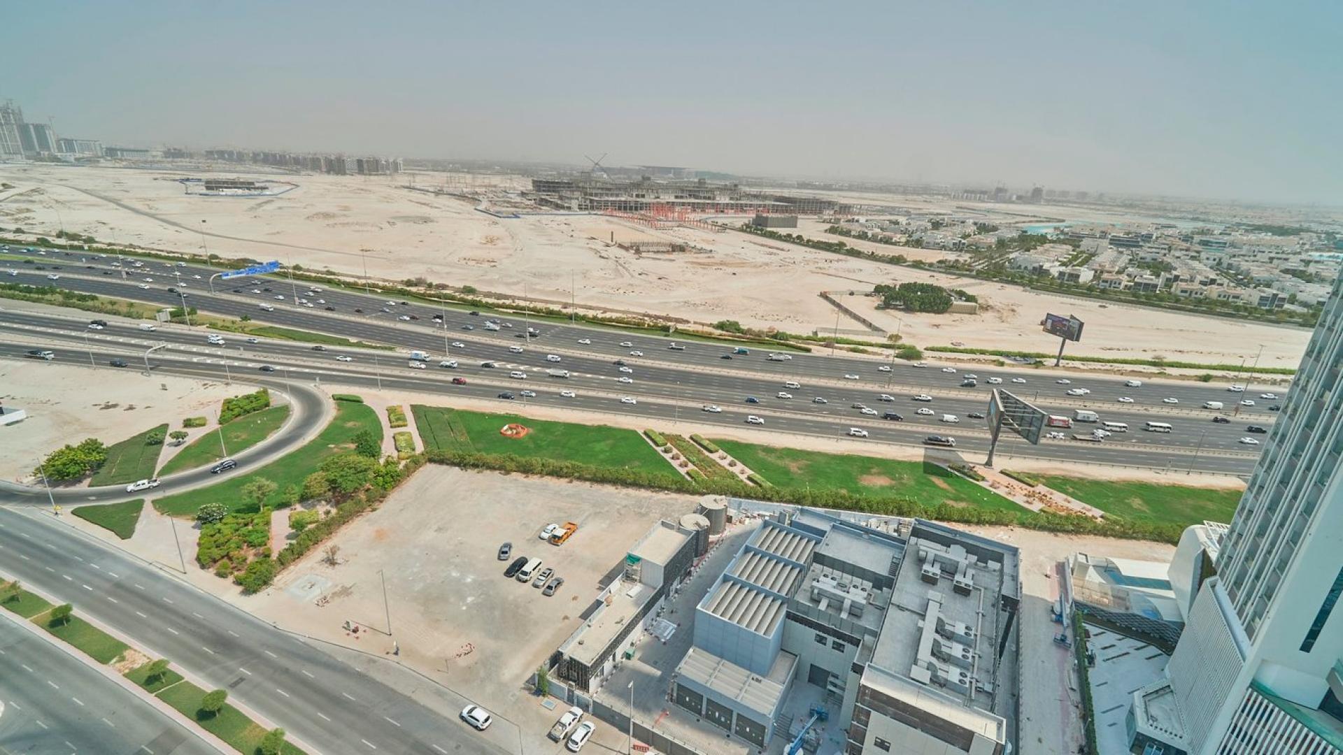 Modern living room in Fairview Residency apartment, Business Bay, with city view balcony