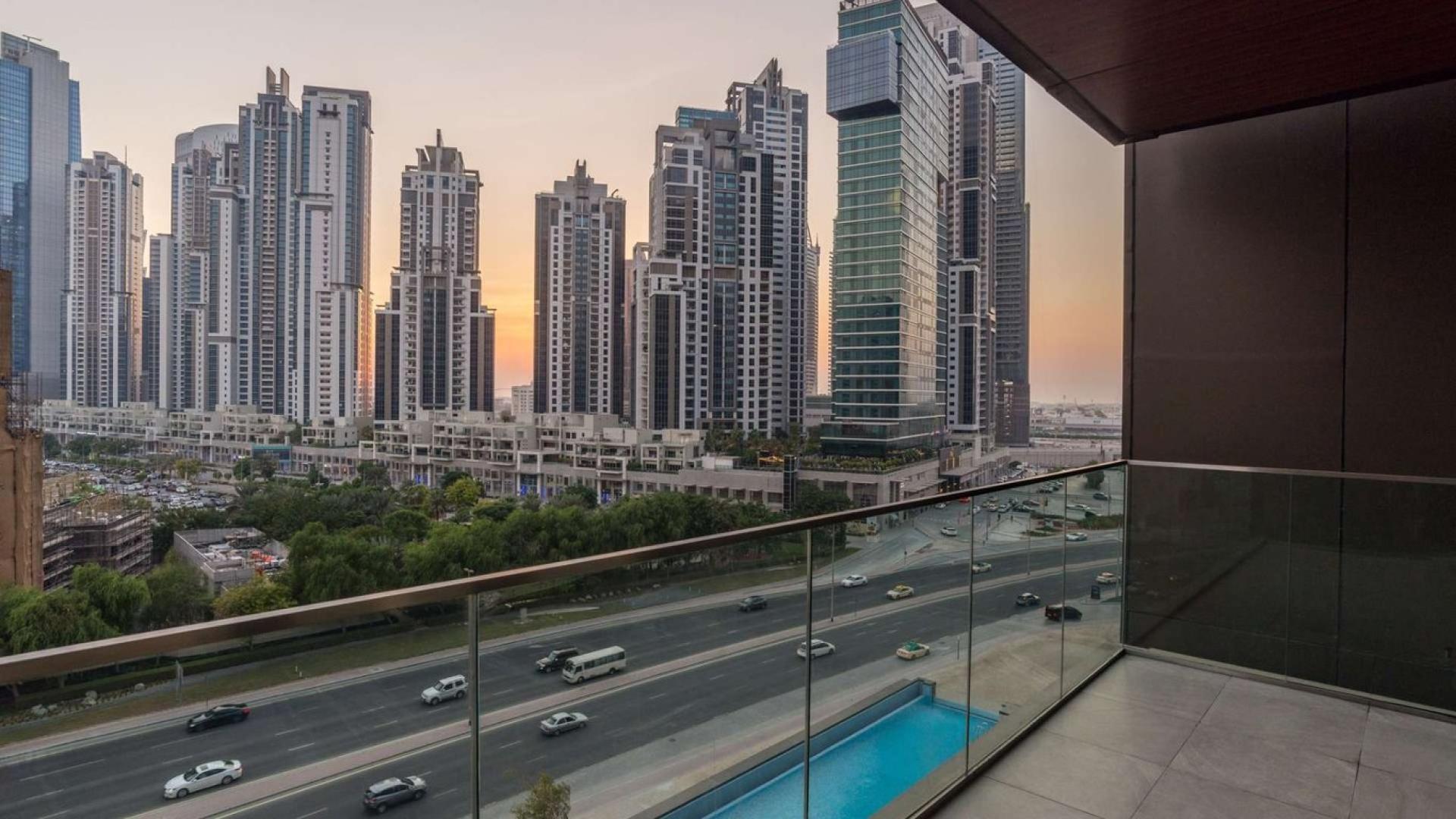 Furnished living room in DT1 Tower apartment, Downtown Dubai, with city views and modern decor