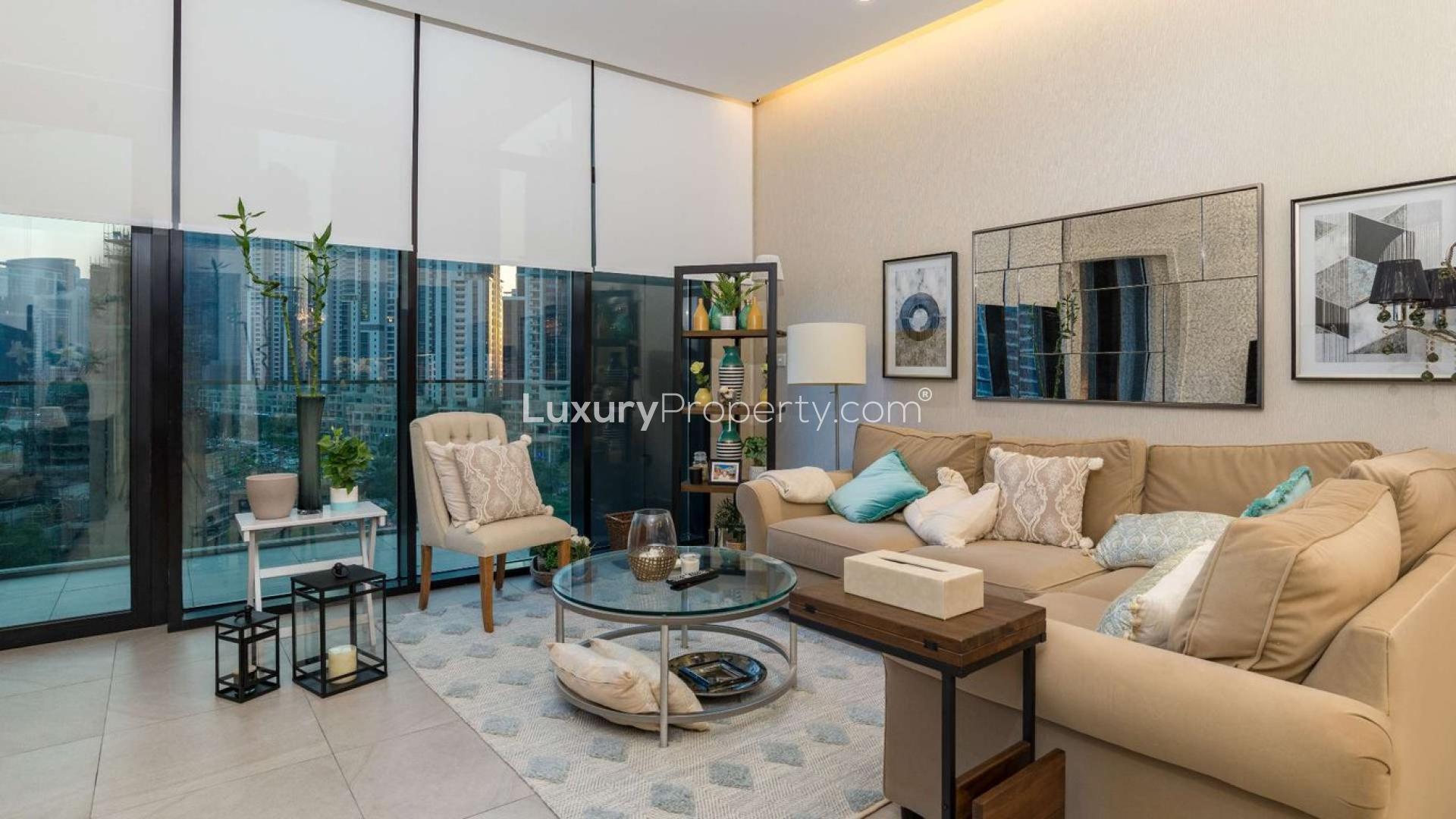 Furnished living and dining area in DT1 Tower apartment, Downtown Dubai, with city views