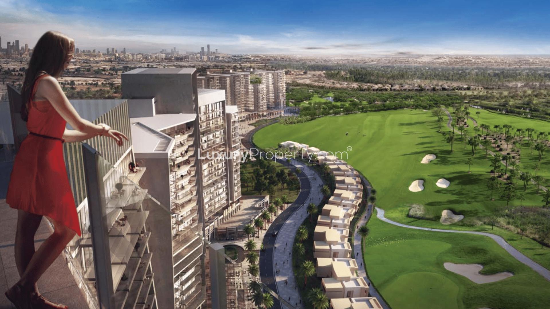 Alt text: "Damac Hills Artesia apartment with golf course views, blue sky, and modern architecture.","Stunning Damac Hills apartment with balcony overlooking golf course and city skyline views.",Modern living and dining area in 1-bed apartment, Damac Hills, with stylish decor