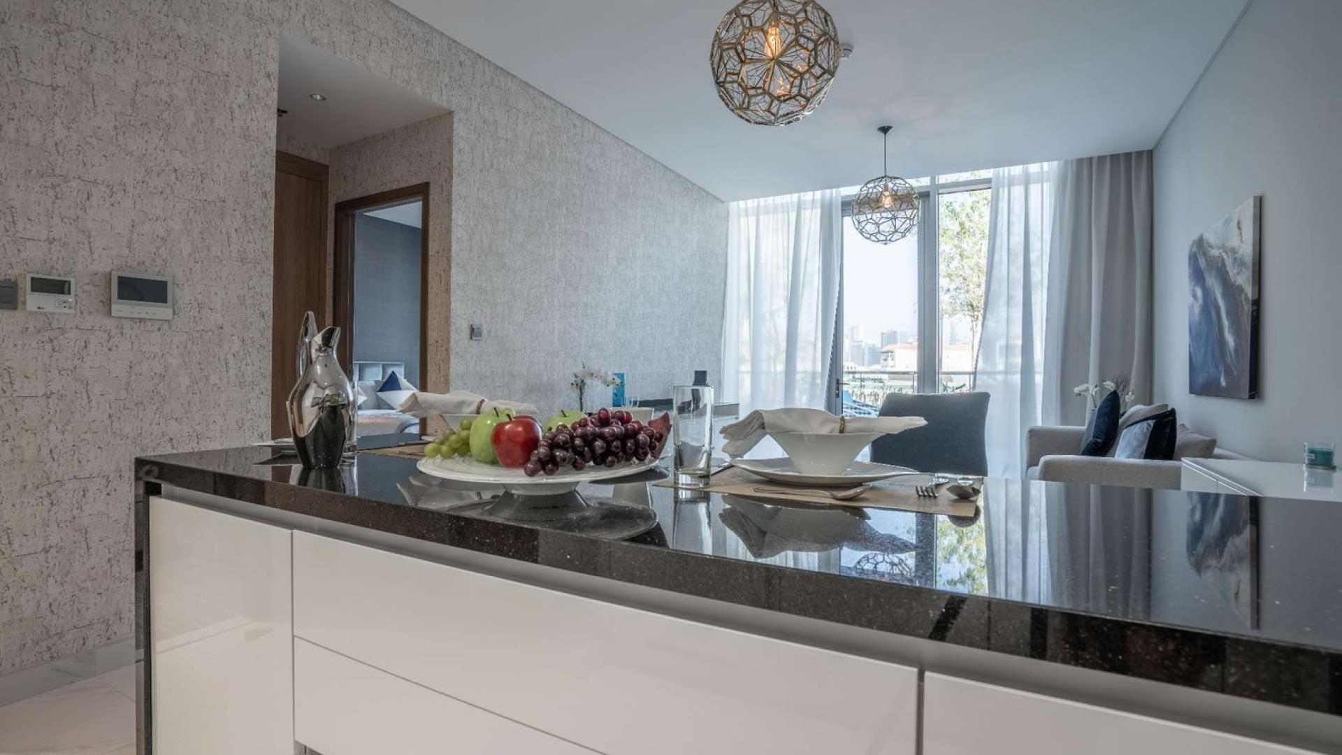 Modern living room and kitchen in 1-bedroom apartment, District One, Mohammed Bin Rashid City