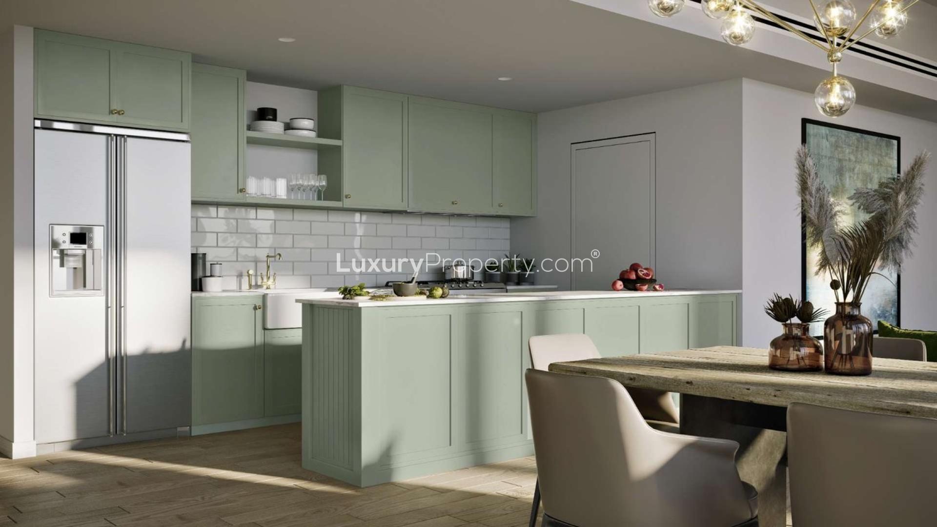 "Celadon at Central Park apartments in City Walk with lush greenery and modern architecture.",Modern kitchen interior in Celadon studio apartment, City Walk, with sleek design and natural light