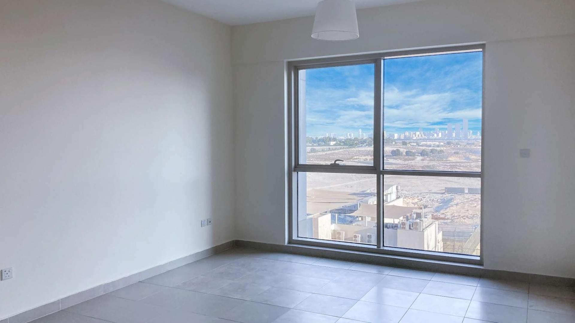 "Bright living room with city view in modern one-bed apartment, Mosela, The Views.",Modern one-bedroom apartment in Mosela, The Views, with large window and cityscape view