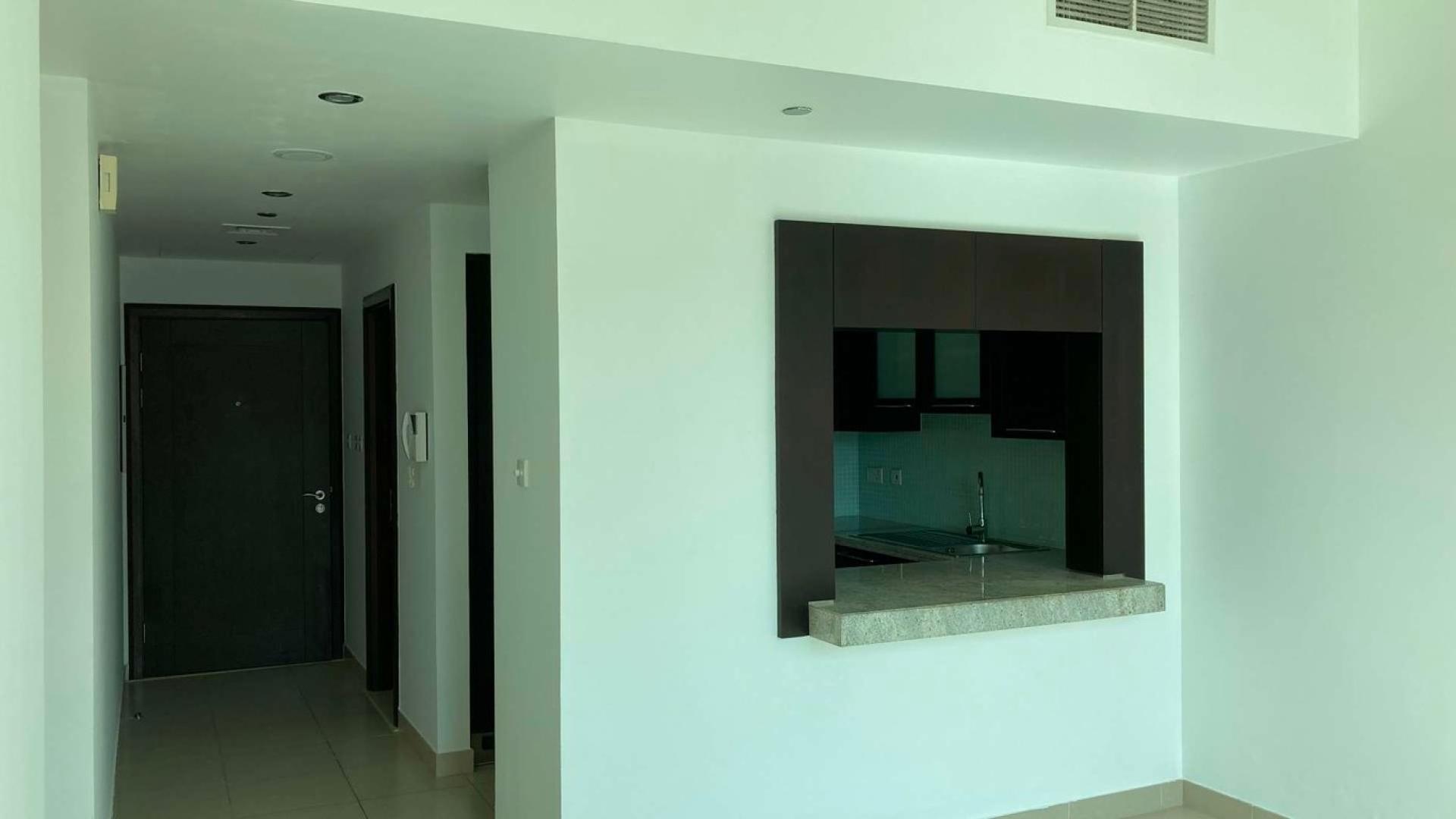 "Stunning view of Mosela apartments by the water in The Views community, for sale.",Spacious balcony with lattice design in Mosela apartment, The Views community