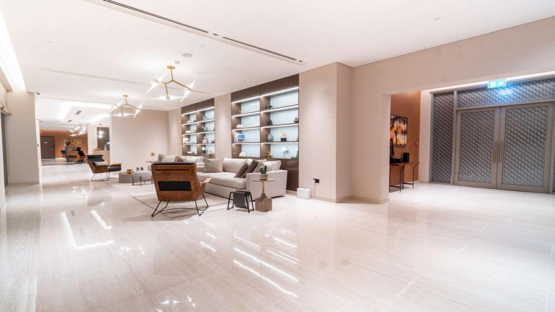 Luxurious lobby in Sobha Hartland apartment, featuring modern decor and elegant seating area