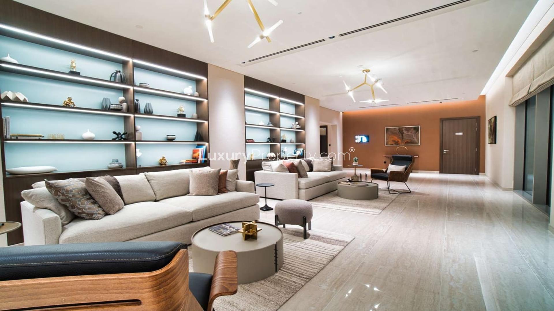 "Modern kitchen in high-floor apartment, Sobha Hartland, Mohammed Bin Rashid City, for sale.",Modern living room in Sobha Hartland apartment with stylish decor and ample seating