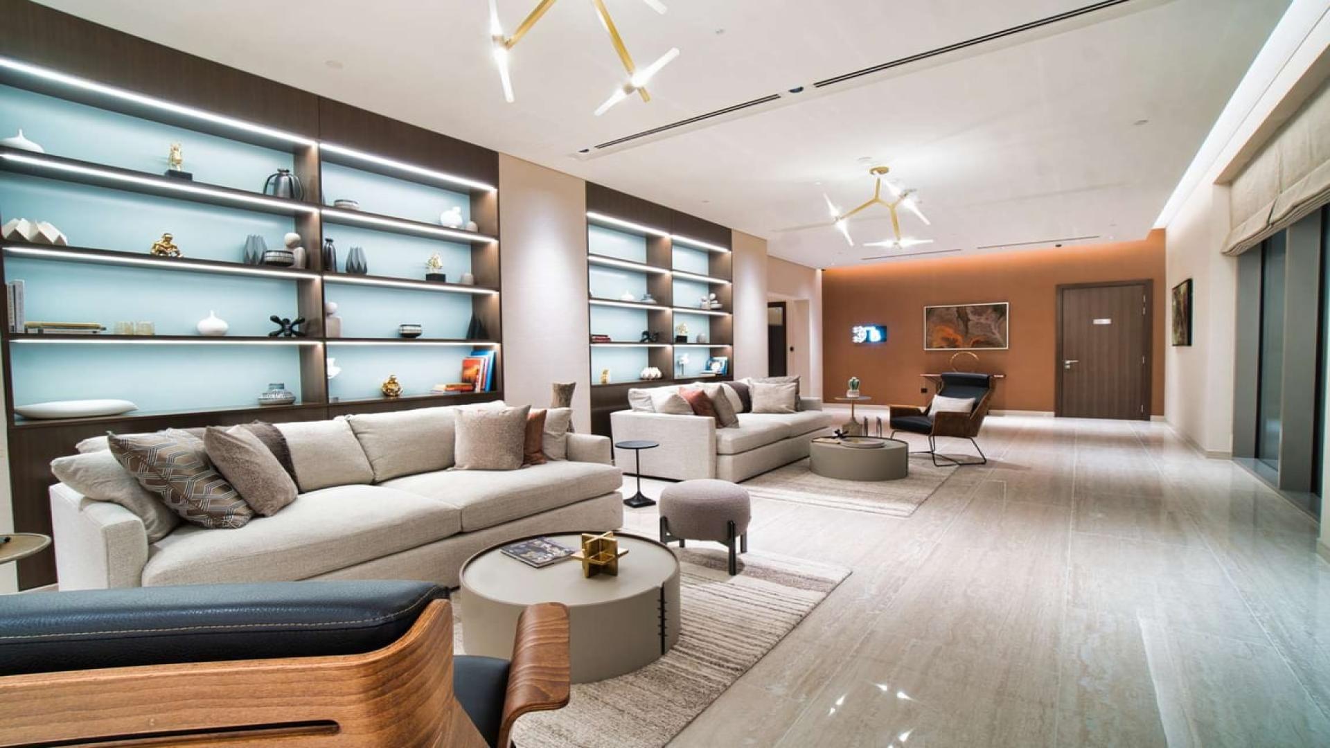 "Modern kitchen in high-floor apartment, Sobha Hartland, Mohammed Bin Rashid City, for sale.",Modern living room in Sobha Hartland apartment with stylish decor and ample seating