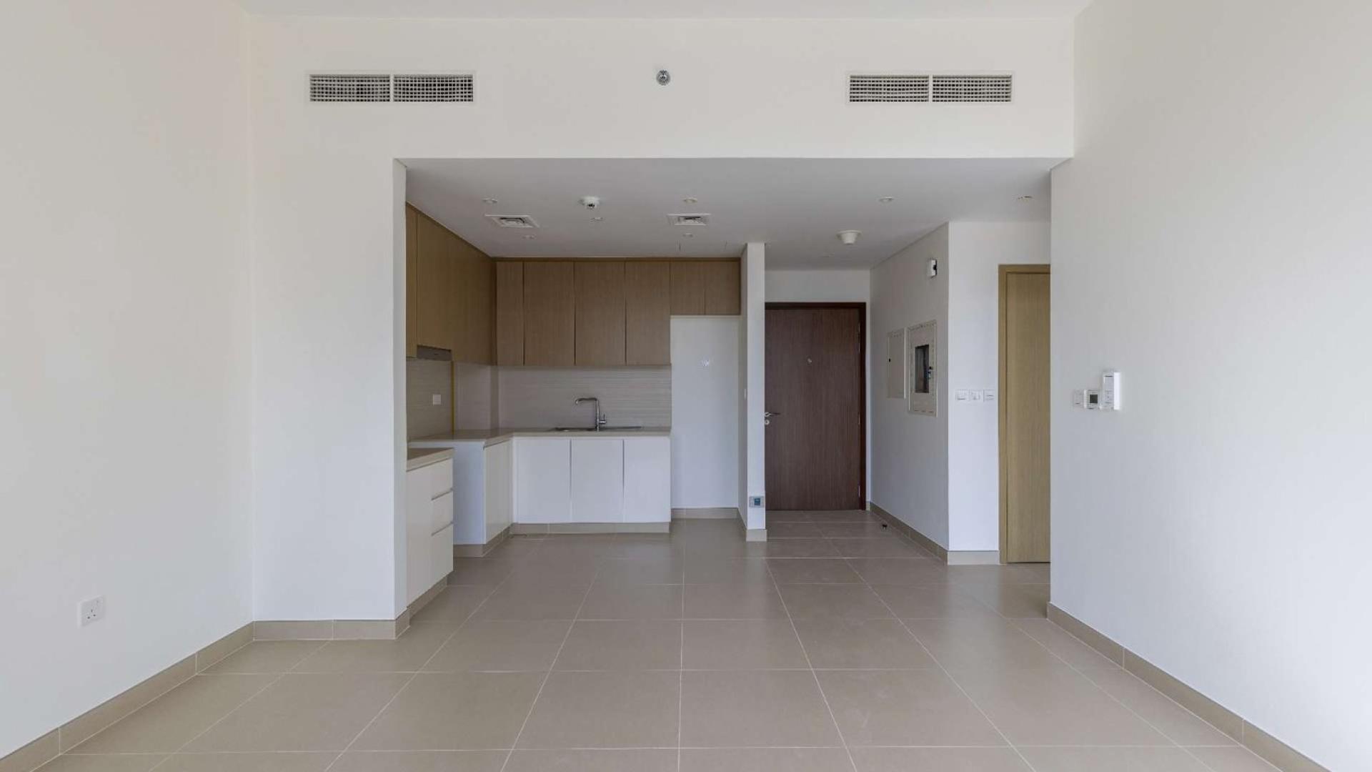 Apartment balcony with stunning Dubai Marina view, modern skyscrapers, and partial sea scenery