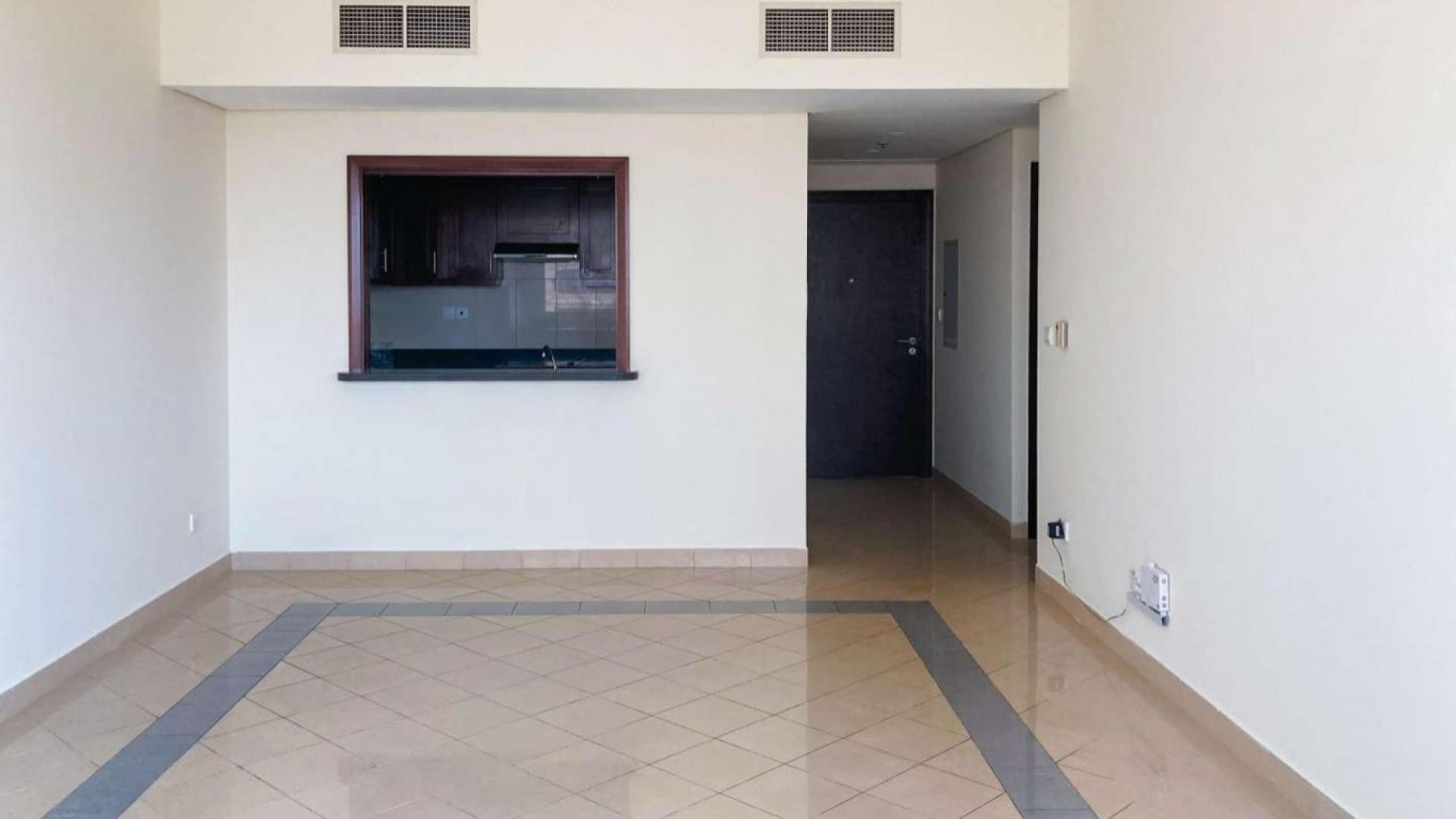 Bright living room with large windows in Golf Tower 2 apartment, The Views