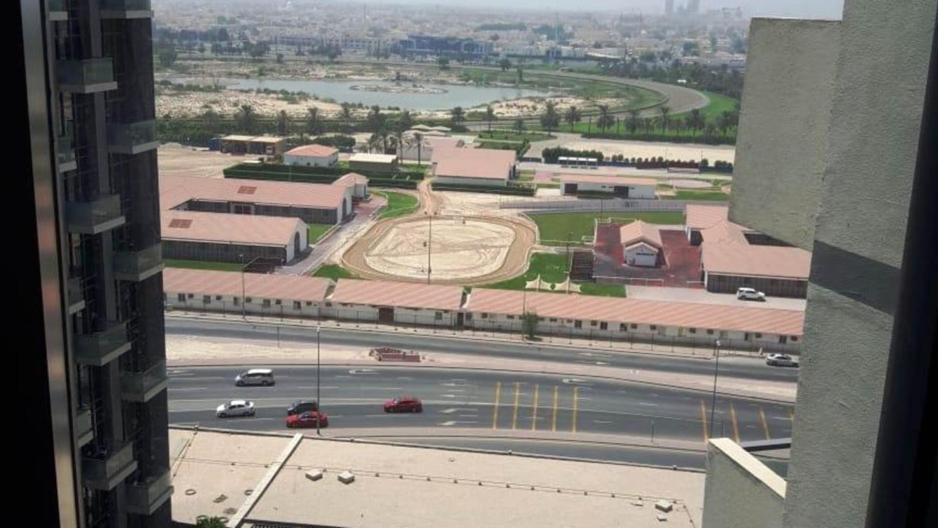 Modern living room in Atria waterfront apartment, Business Bay, featuring cozy seating and dining area