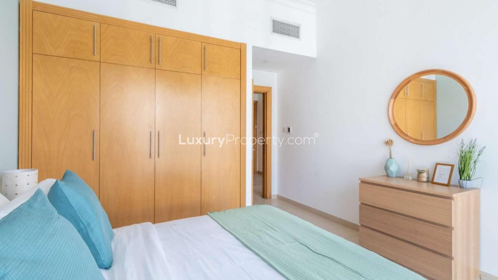 Furnished bedroom reflection in mirror, Mayfair Residency apartment, Business Bay, for sale