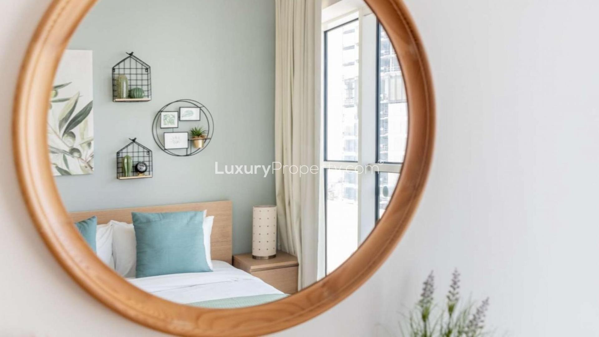 Furnished bedroom with balcony view in Mayfair Residency, Business Bay apartment for sale