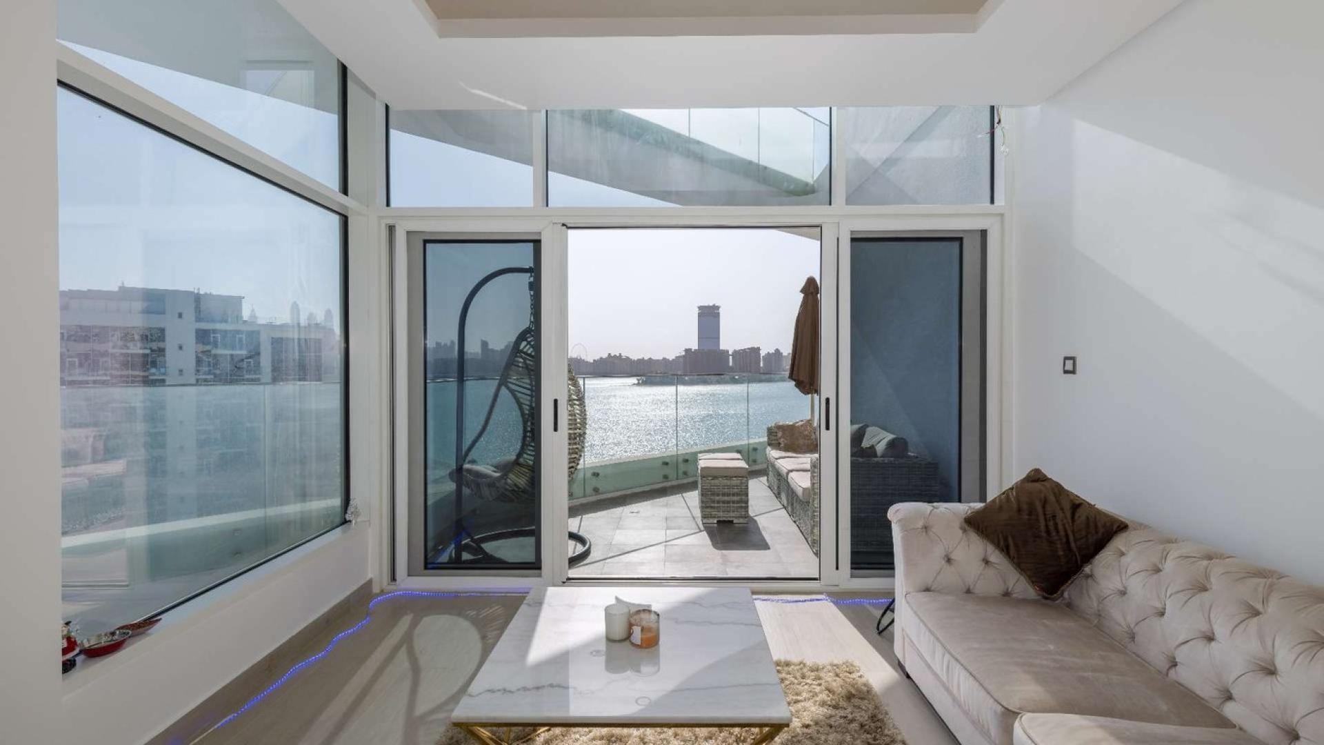 Bright living room with sea view in Palm Jumeirah apartment, MINA by Azizi