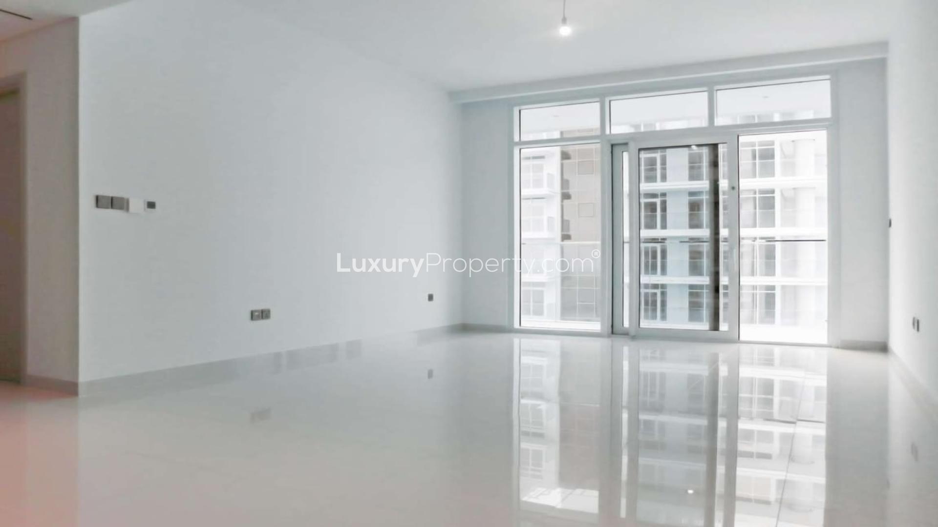 Aerial view of Dubai Harbour marina, skyline, and waterfront near Emaar Beachfront apartments