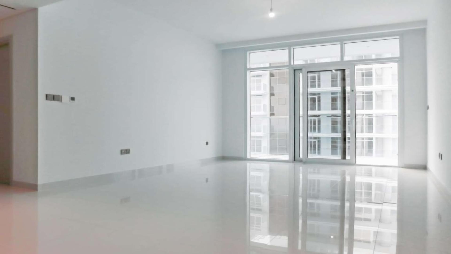 Aerial view of Dubai Harbour marina, skyline, and waterfront near Emaar Beachfront apartments