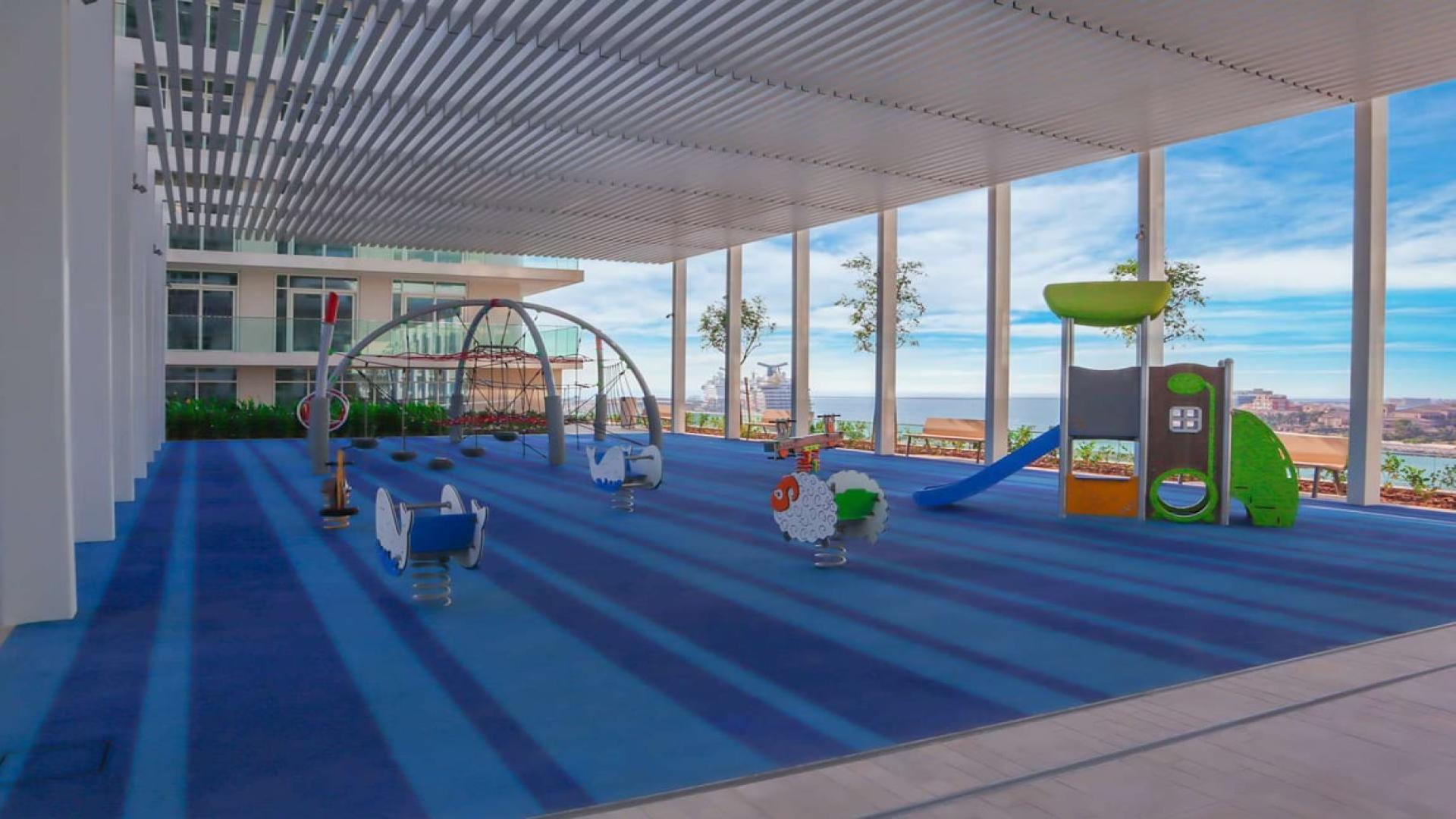 "Stunning view from one-bedroom apartment in Emaar Beachfront, Dubai Harbour, overlooking Palm Jumeirah.",Children's play area at Emaar Beachfront apartment, Dubai Harbour, with Palm view