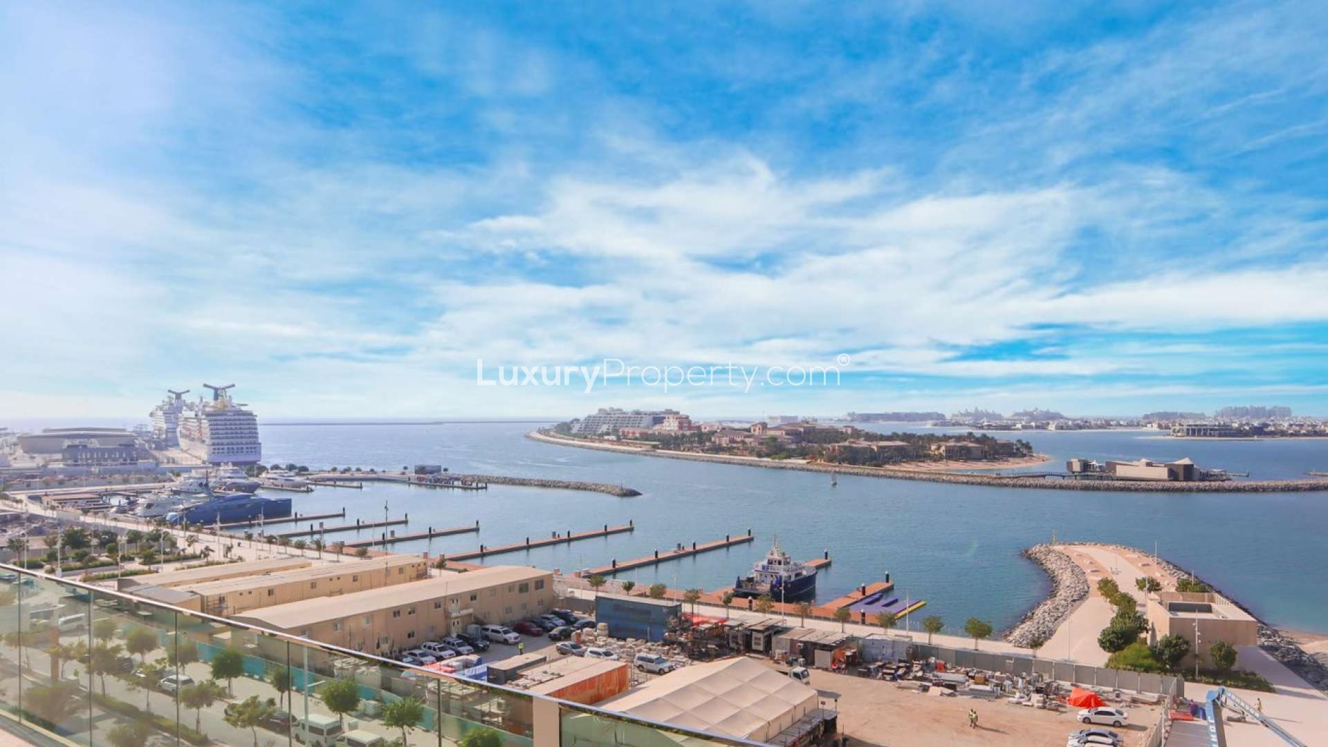 Emaar Beachfront apartment balcony with stunning view of Dubai Harbour and Palm Jumeirah