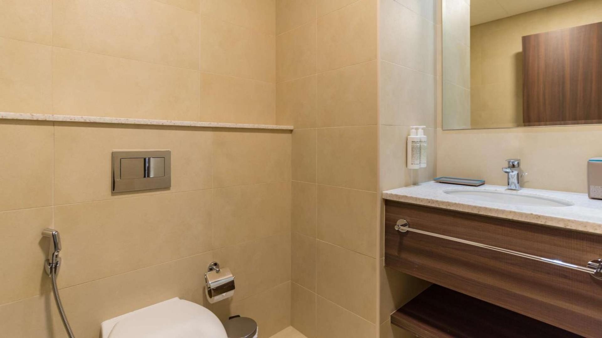 Modern living room in fully furnished 1-bedroom apartment, Avani Palm View, Dubai Media City