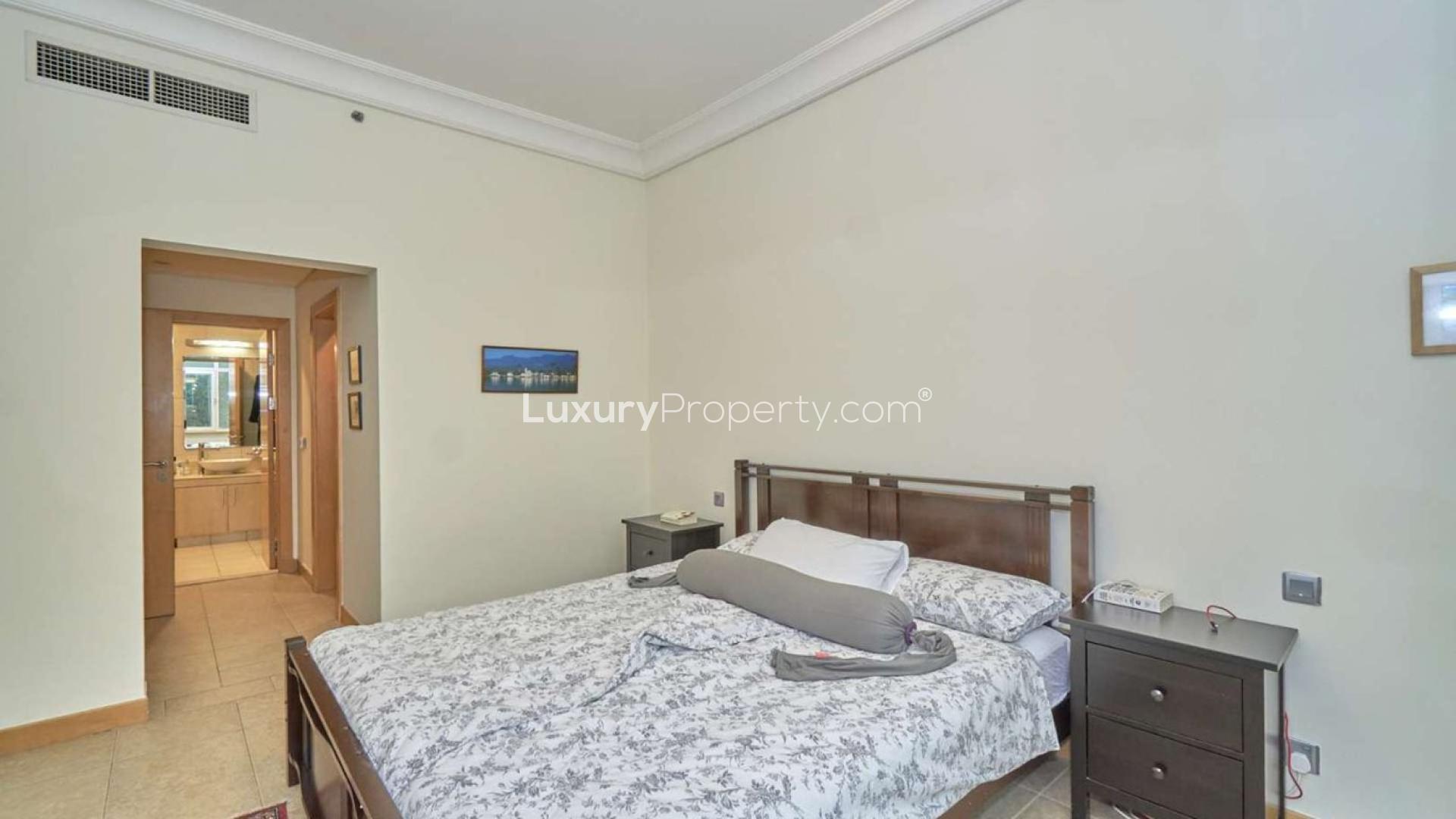 Balcony view from Shoreline Apartments, Palm Jumeirah, overlooking greenery and nearby buildings