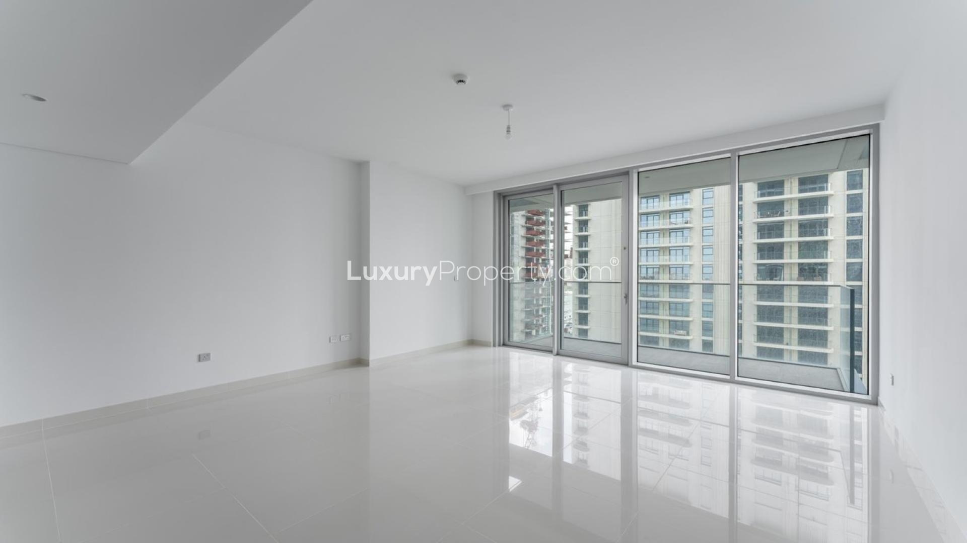 Modern one-bedroom apartment interior with city views at Emaar Beachfront, Dubai Harbour