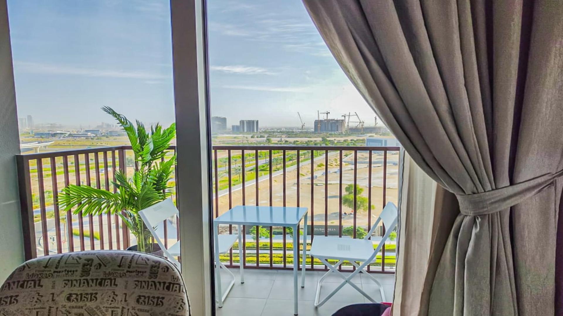 Furnished bedroom with large window view in Dubai Hills Estate apartment, Collective 2.0