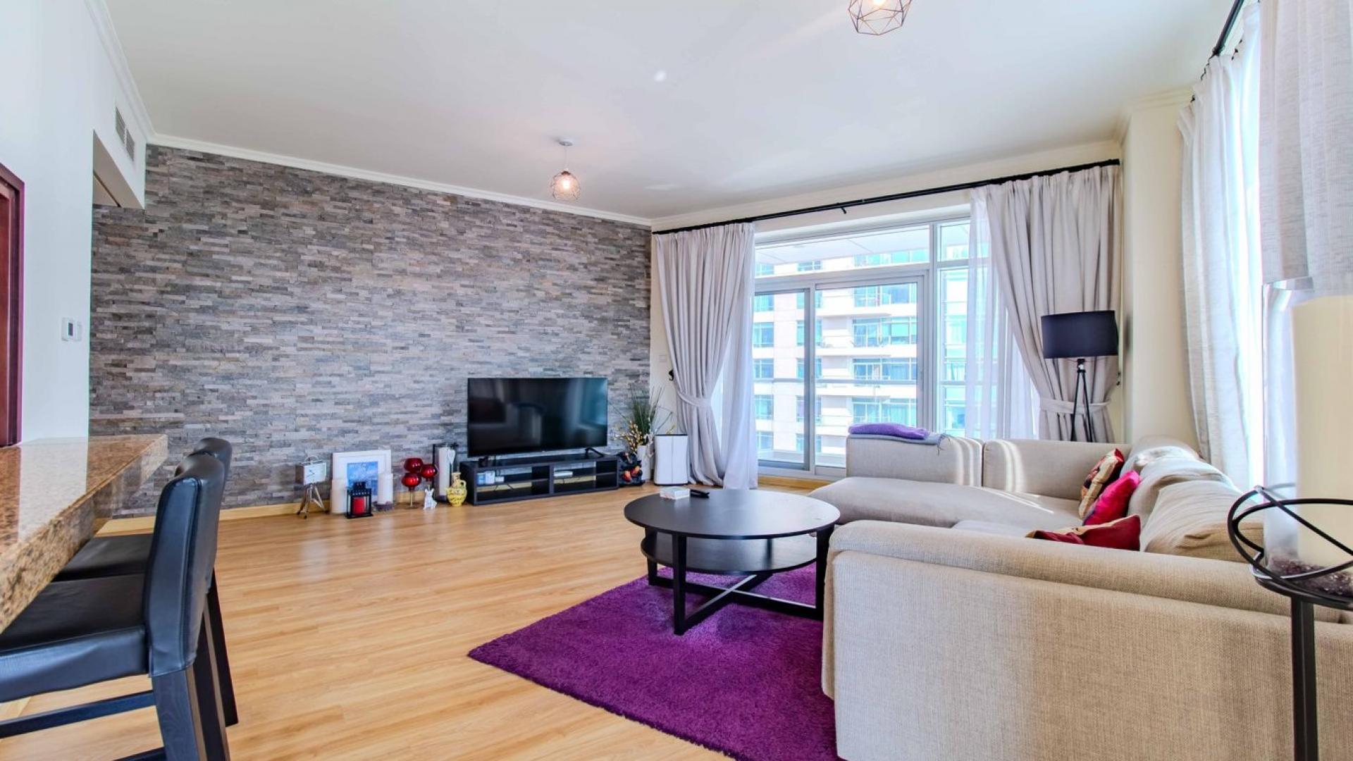 Modern living room in Downtown Dubai apartment, featuring stylish decor and open layout