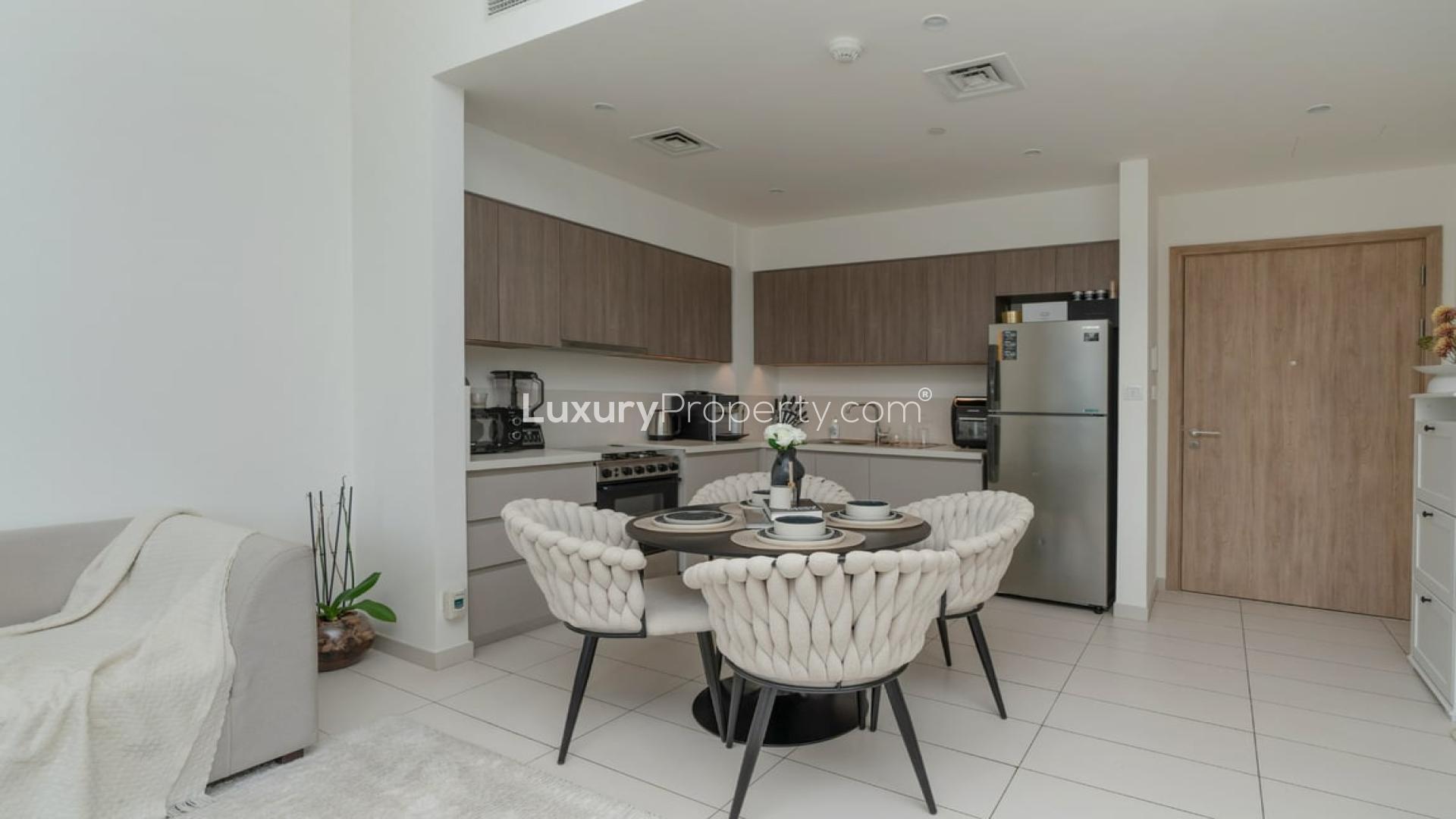 Modern living room in Executive Residences 1 apartment, Dubai Hills Estate, with balcony view