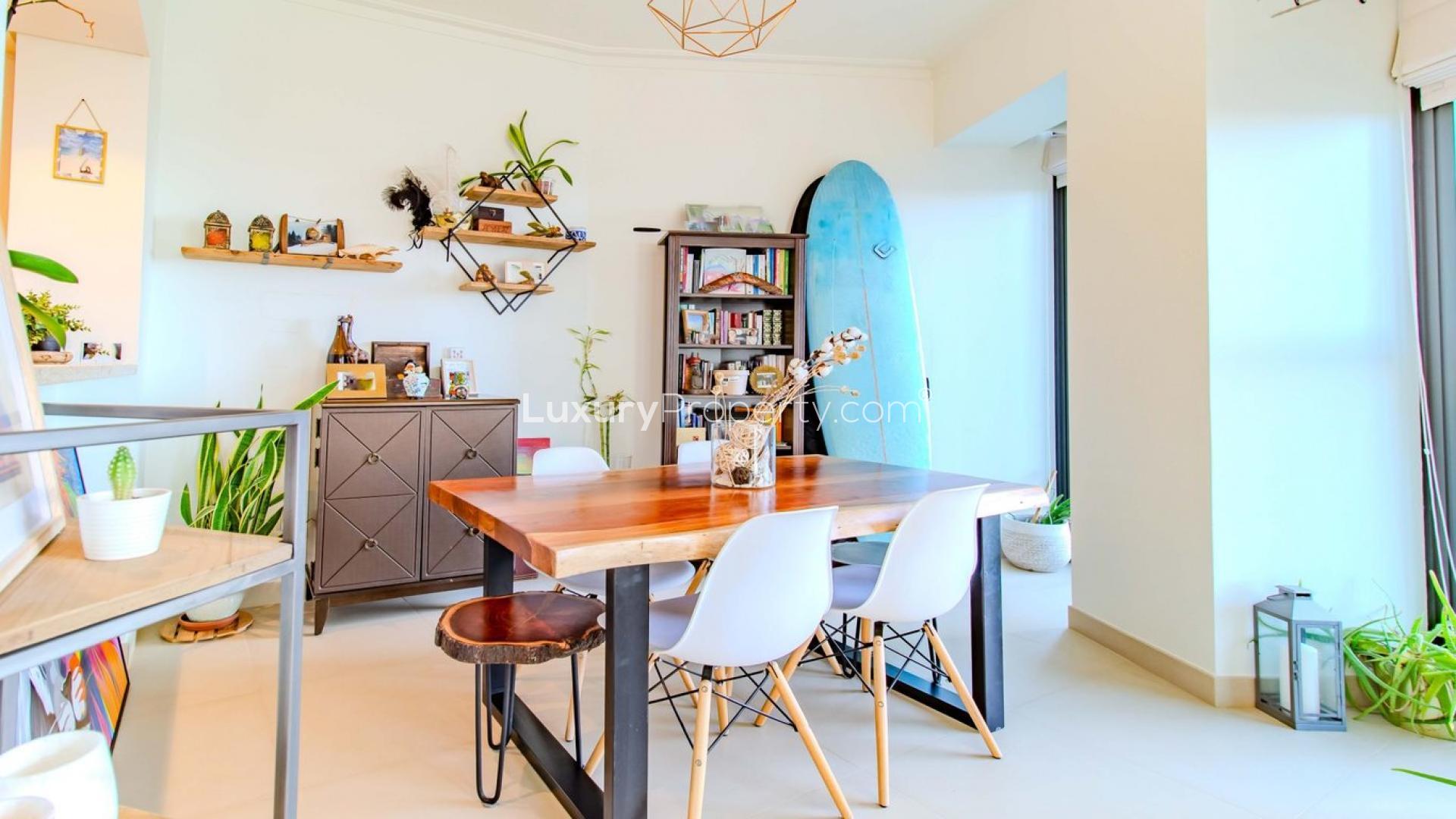 Bright living room in Burj Vista apartment, Downtown Dubai, with modern decor and large windows