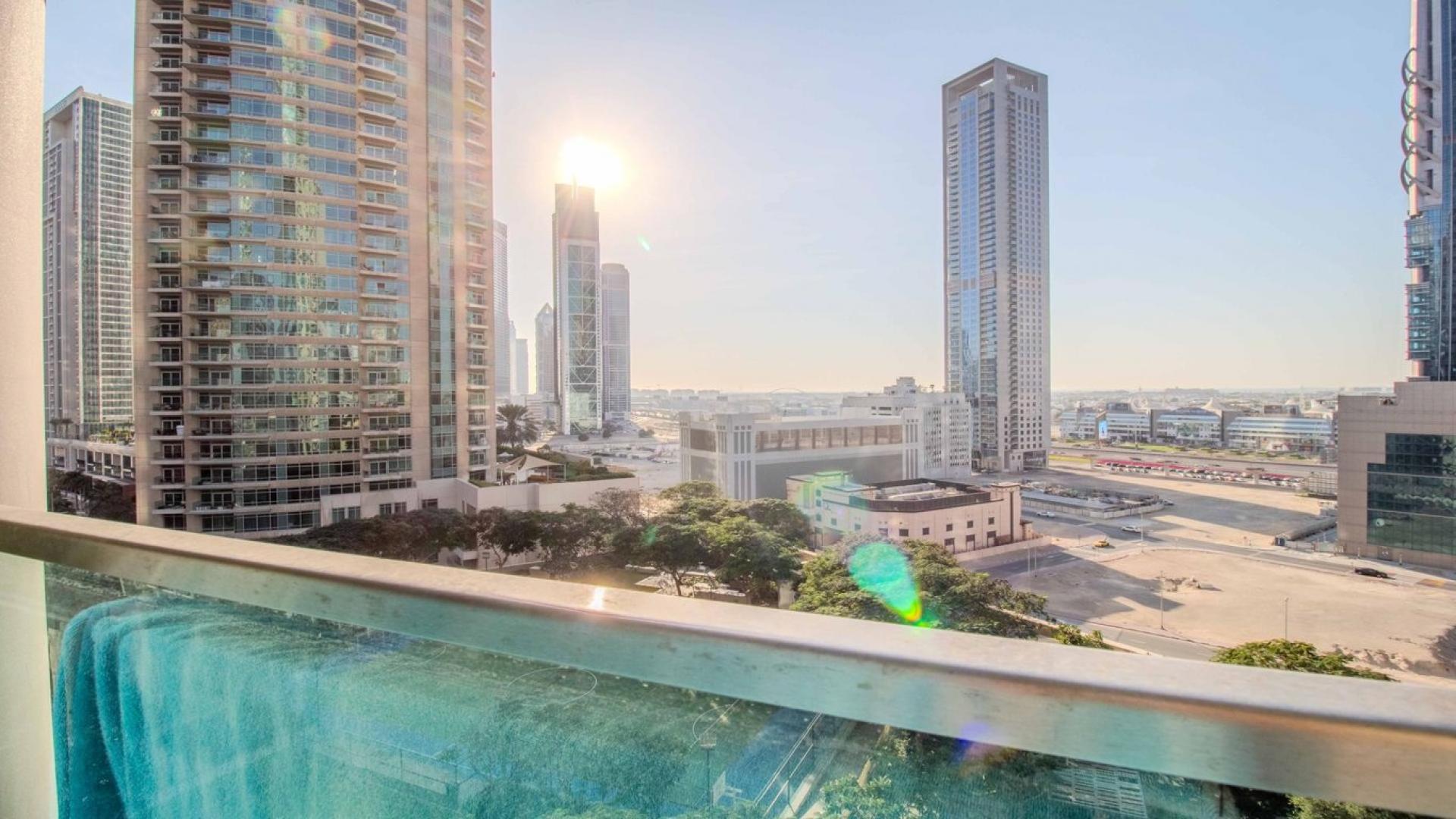 Modern living room in Burj Vista apartment, Downtown Dubai, featuring stylish decor and natural light