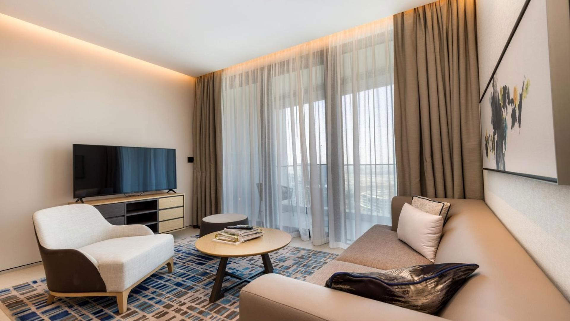 Modern kitchen and dining area in Jumeirah Beach Residence 1-bedroom apartment for sale