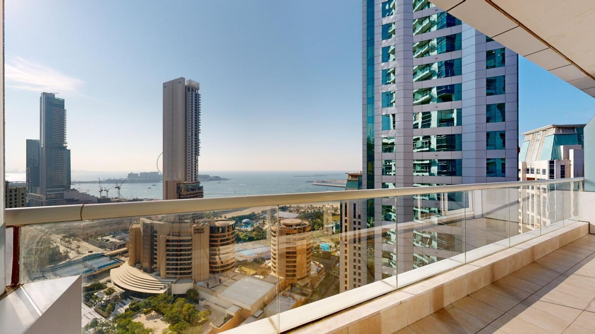 Modern living room and dining area with sea views at Botanica Tower, Dubai Marina