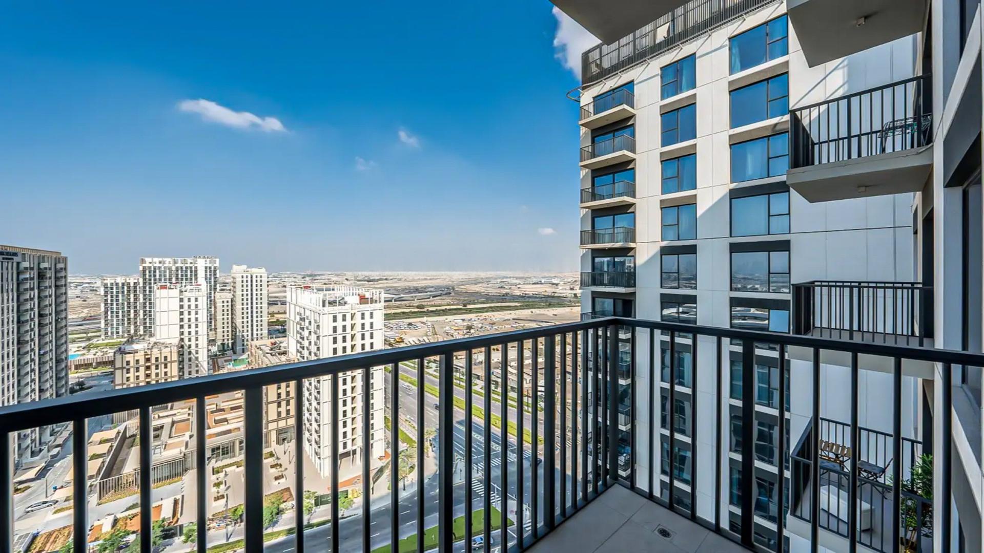 Modern open-plan kitchen and living area in Dubai Hills Estate apartment, Park Ridge