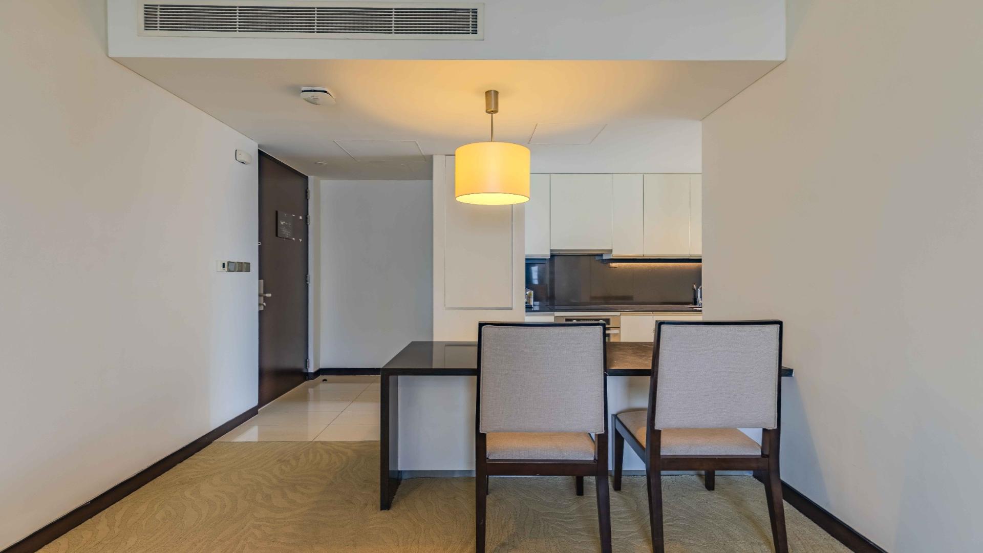 High-floor one-bedroom apartment living area in The Address Dubai Marina for sale