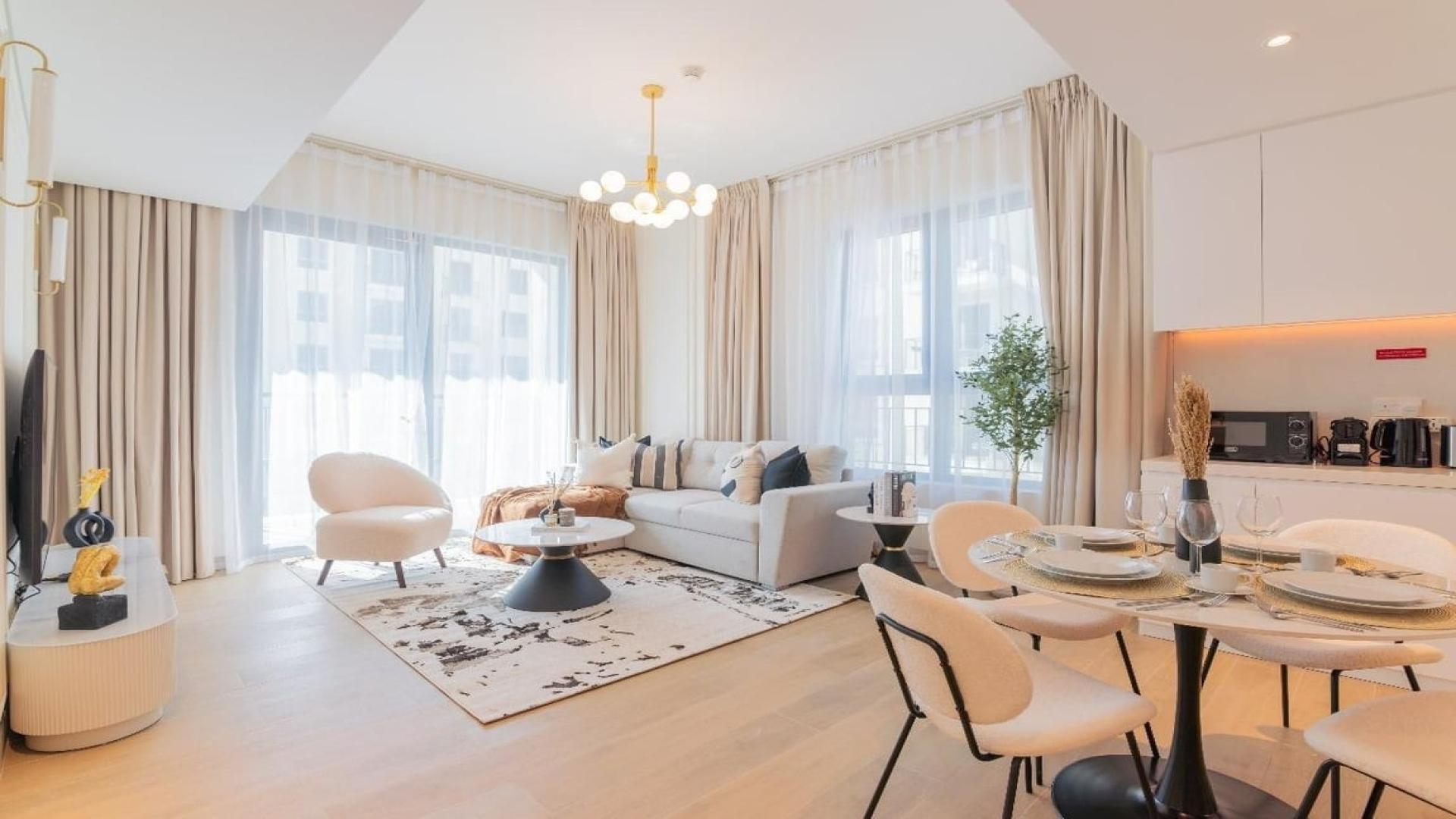 Fully furnished 1-bedroom apartment living room in La Voile, Jumeirah with modern decor