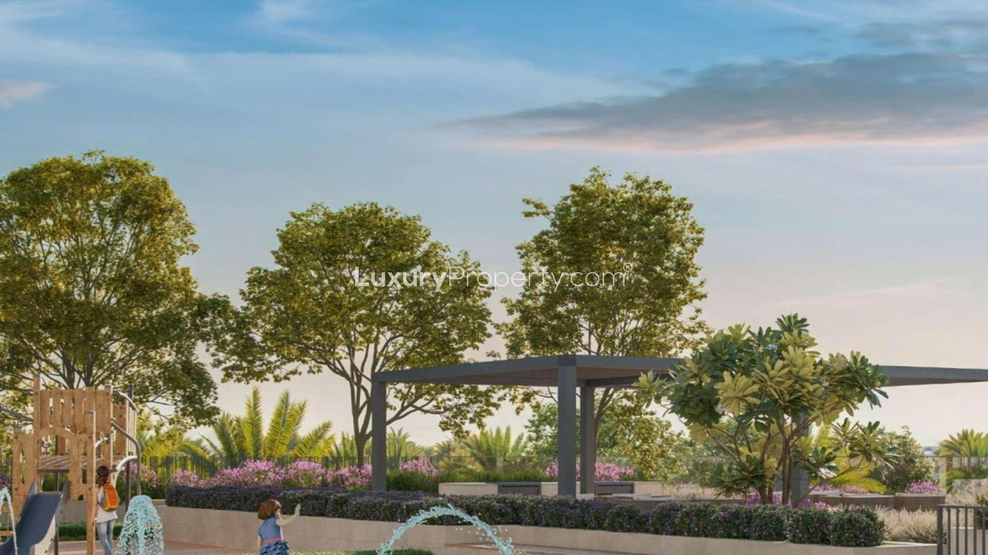 Modern living room in Dubai Hills Estate apartment with stylish sofa and indoor plant