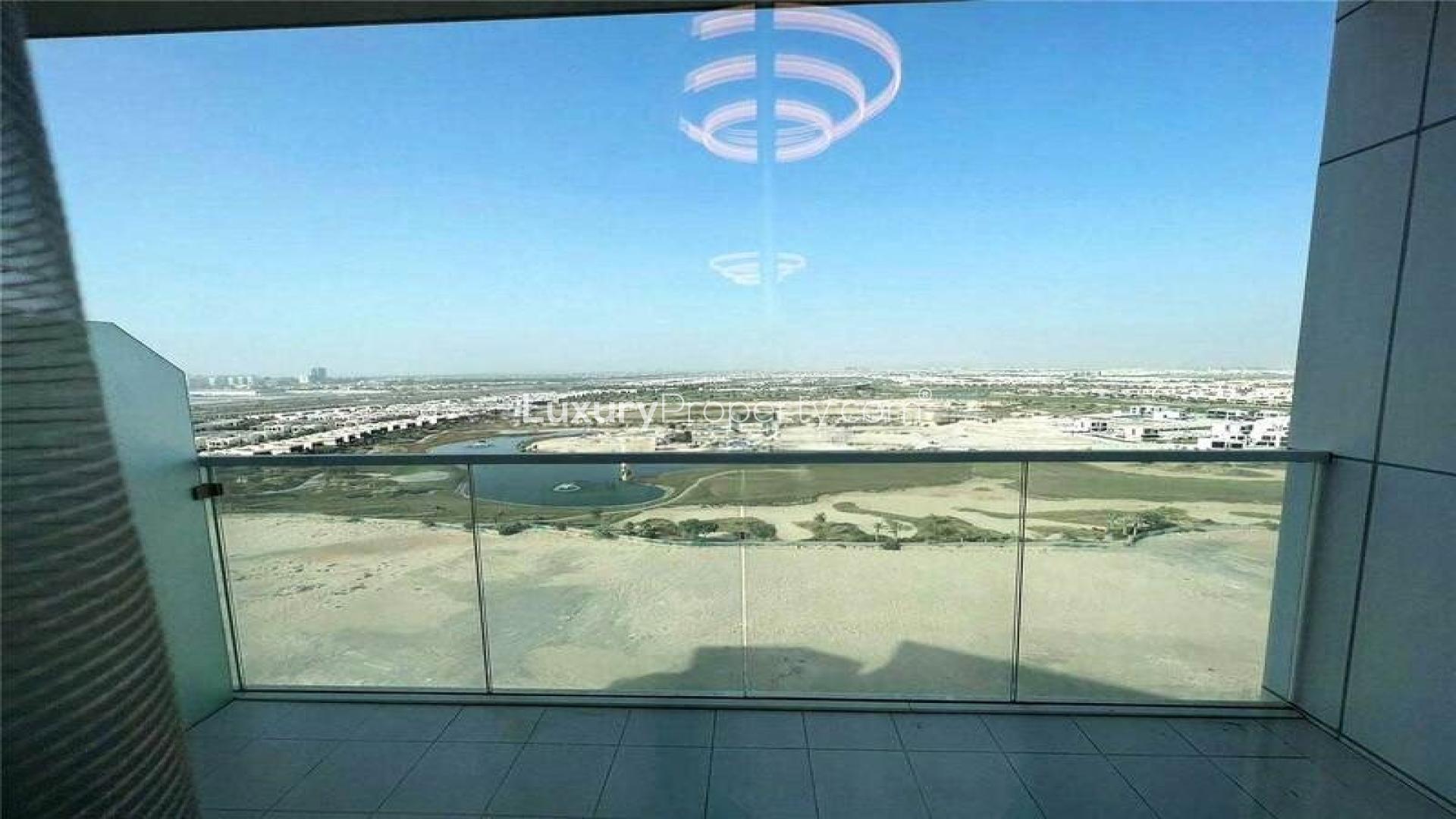 Luxury furnished apartment kitchen and living area in Artesia, Damac Hills for sale