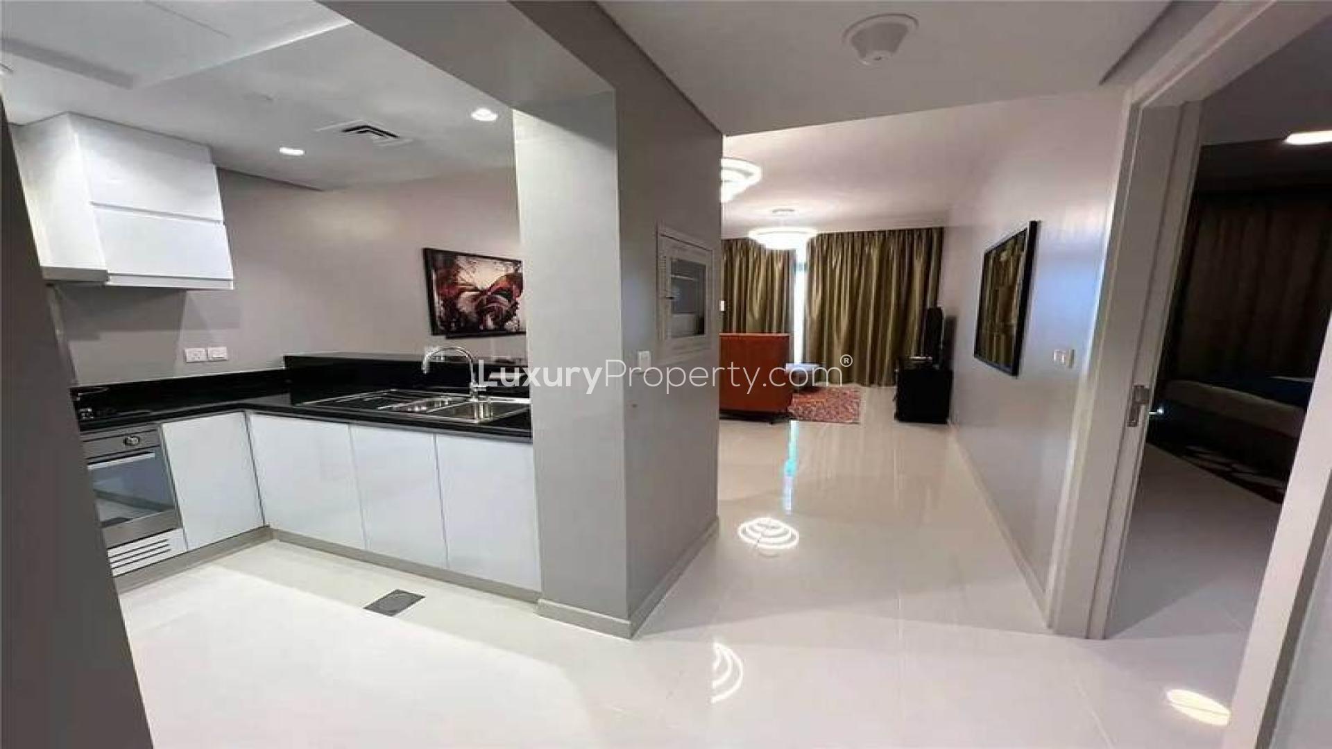 Luxury furnished apartment building in Damac Hills, Artesia, with golf course view for sale