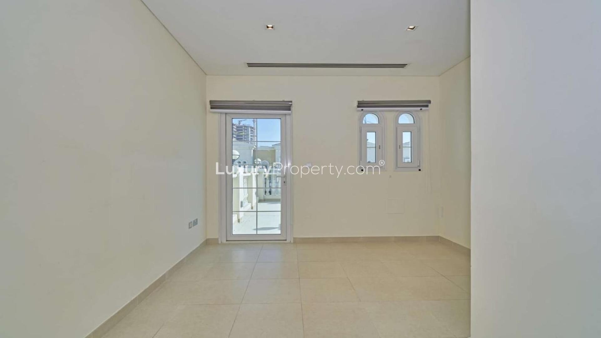 Exterior view of 1-bedroom townhouse with garden in Jumeirah Village Circle, Nakheel Townhouses