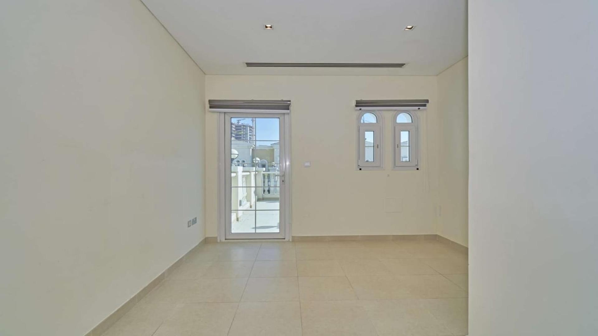 Exterior view of 1-bedroom townhouse with garden in Jumeirah Village Circle, Nakheel Townhouses