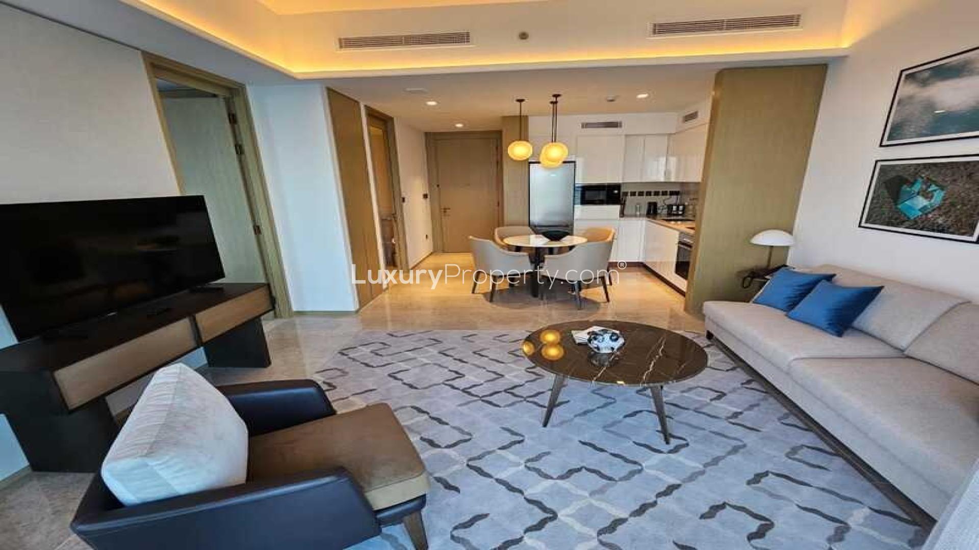 "Stunning waterfront view from 1-bedroom apartment balcony in Address Harbour Point, Dubai Creek Harbour.",Furnished living area in 1-bedroom apartment, Address Harbour Point, Dubai Creek Harbour