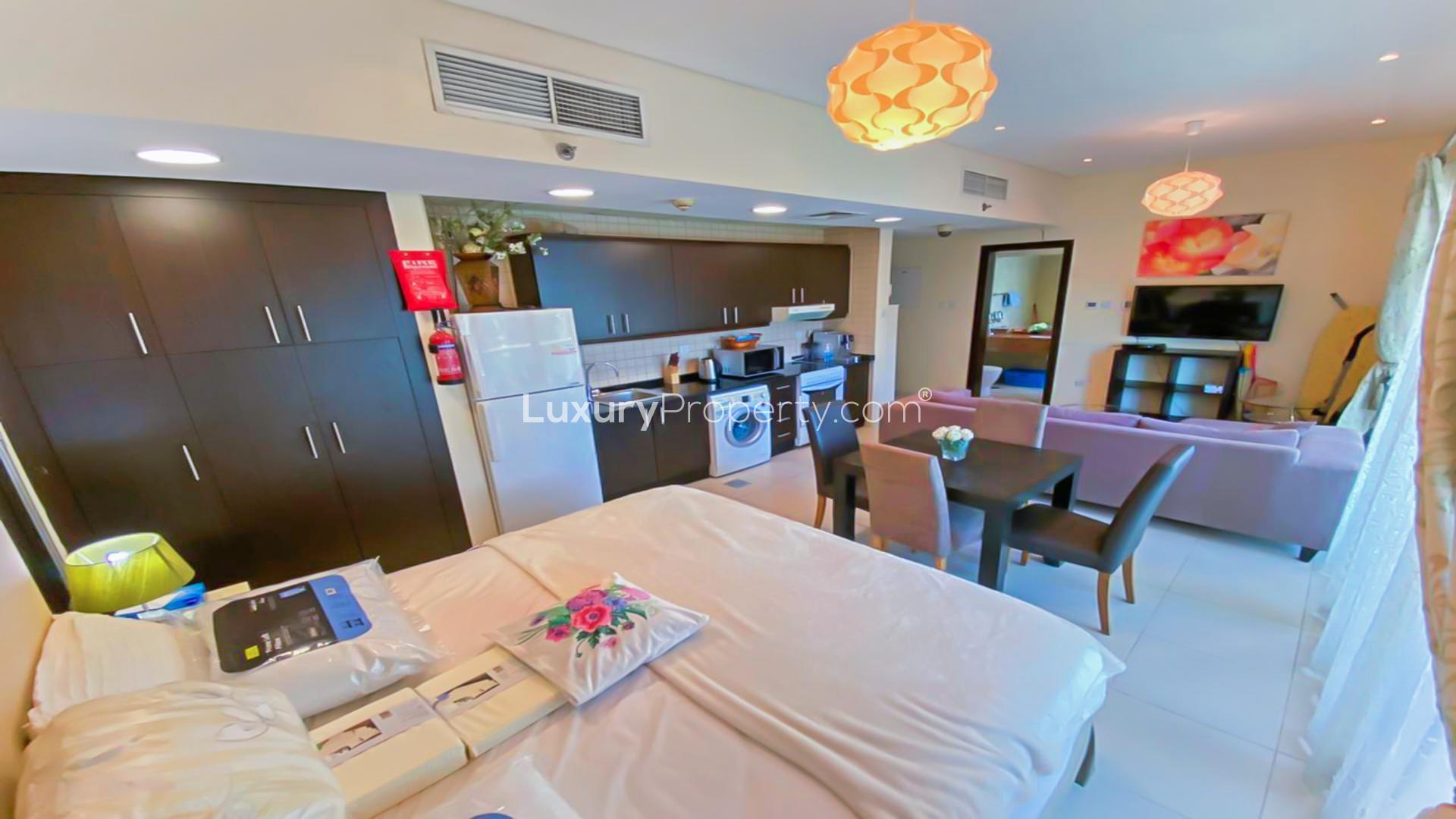 Modern 1-bedroom apartment interior in Royal Oceanic, Dubai Marina with balcony view