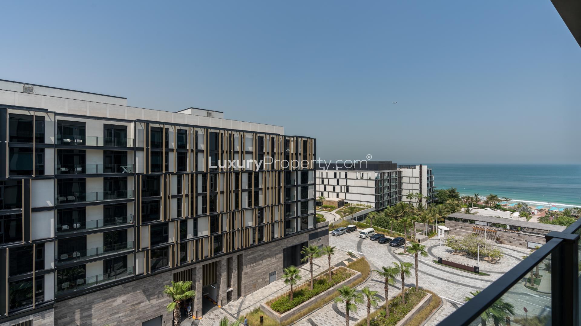 Furnished living room in 1-bedroom apartment, Caesars Bluewaters Dubai, modern decor, natural light